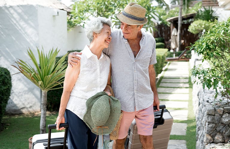 elderly couple having a side embrace on a trip