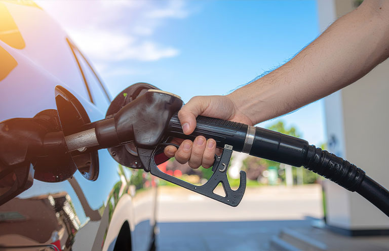 person pumping gas