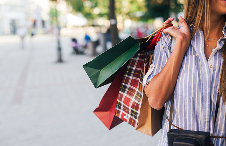 woman holding shopping bags