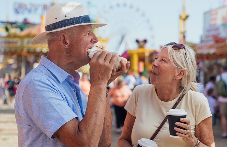 elderly couple at theme park