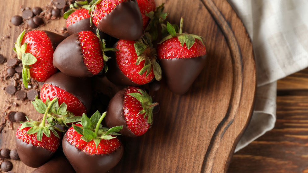 Chocolate Covered Strawberries on a cutting board