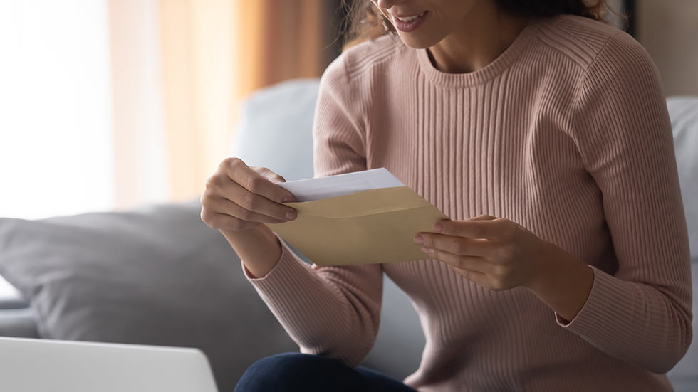 Woman looking at greeting card