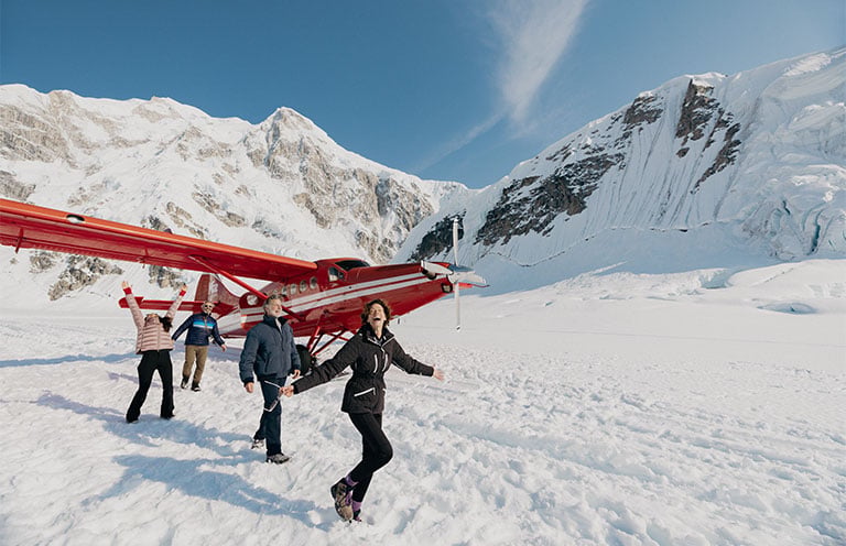 People with snowboards in Denali National Park