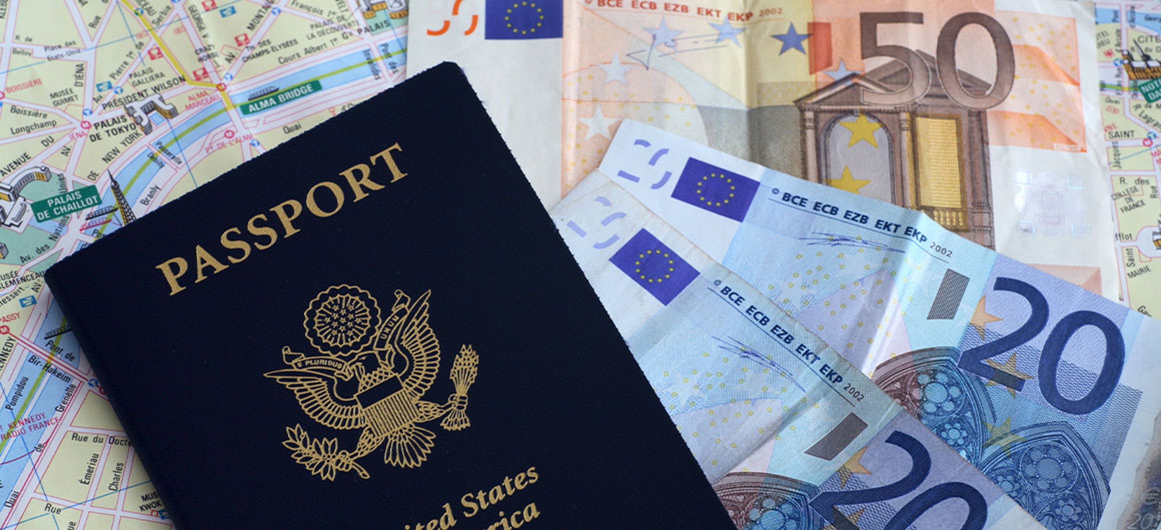 passport and money on a travel map