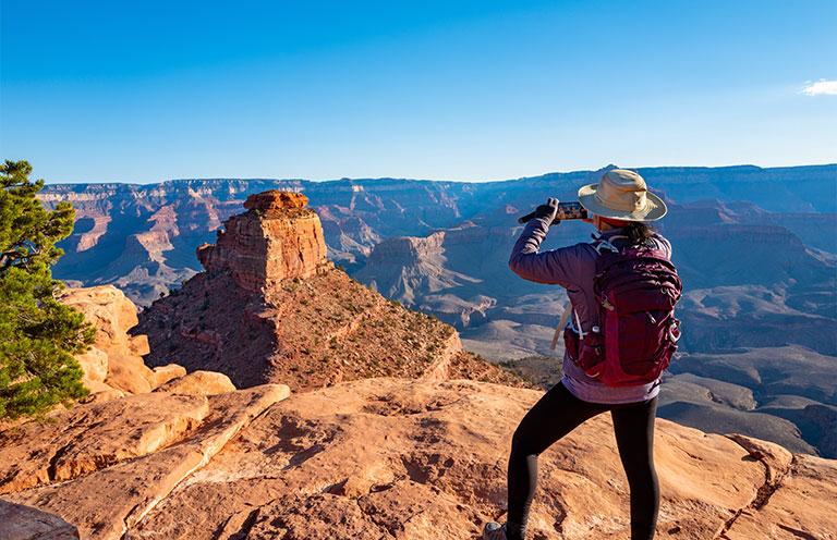 man looking out at grand canyon