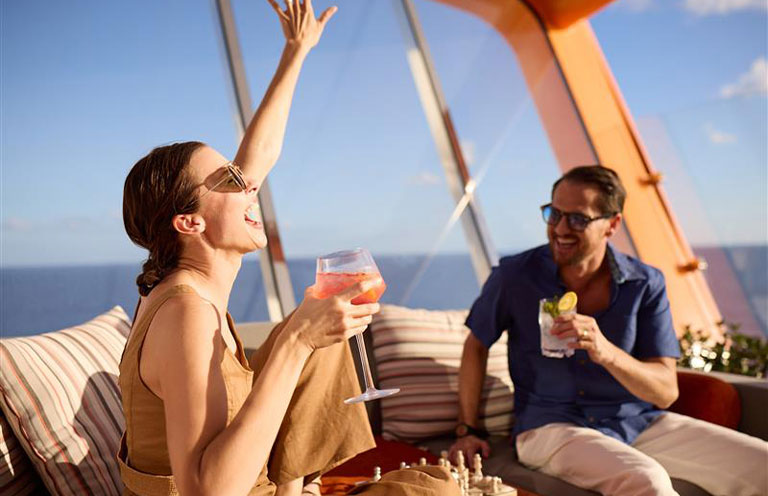 man and woman on the Magic Carpet on Celebrity Cruise Ship