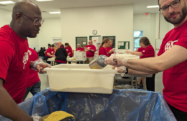 AAA workers packing food at food bank