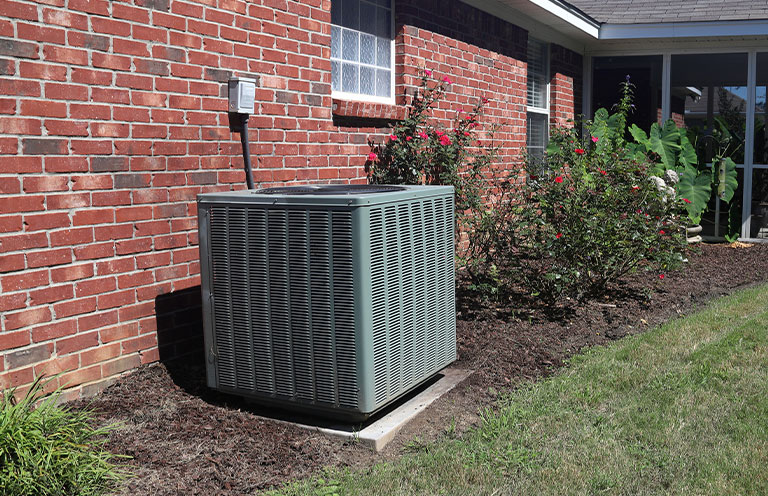 Air Conditioner system next to a house