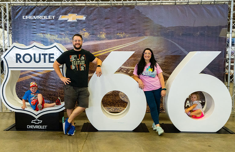family posing with rt 66 sign