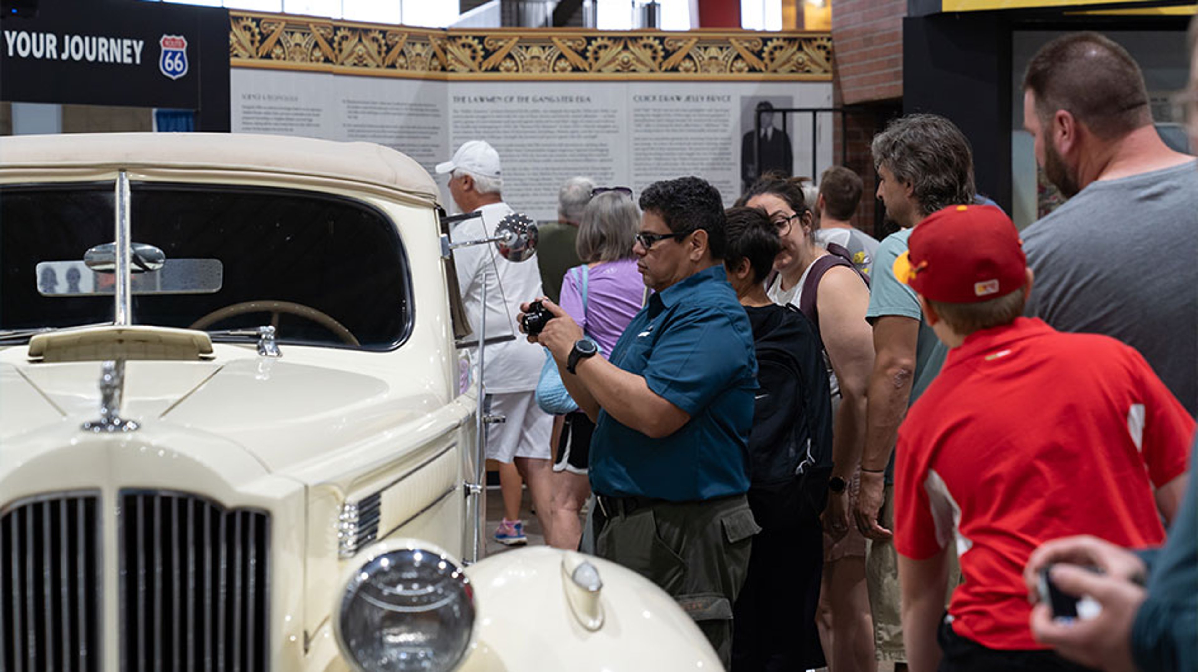 people looking at classic car at rt 66 fest