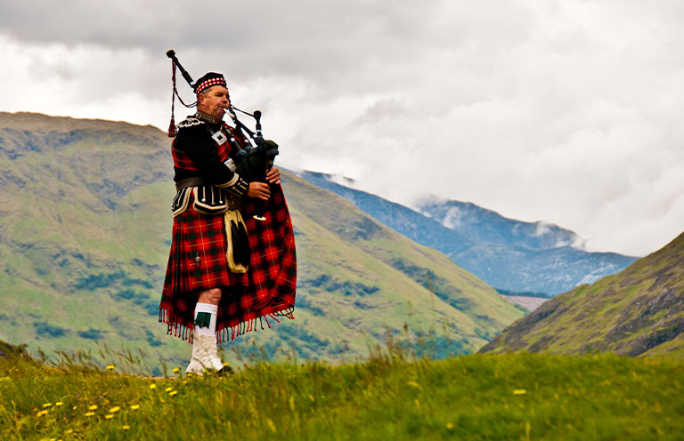 Man playing bag pipe