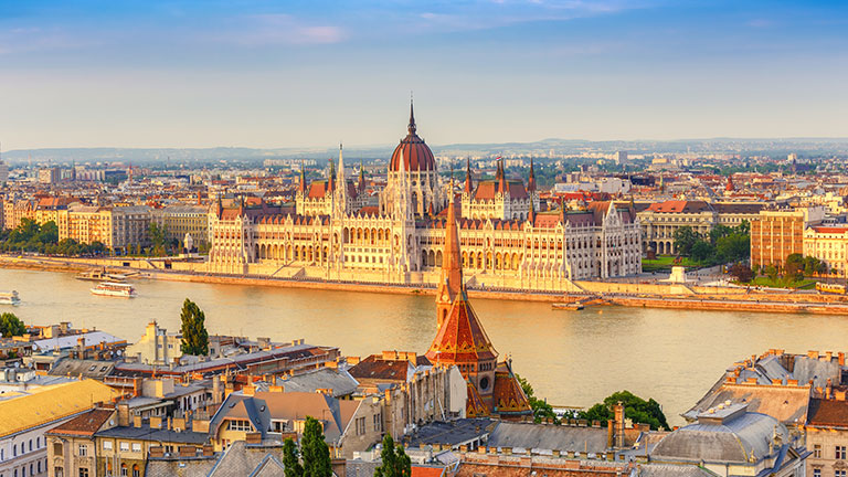 Budapest skyline glowing along the Danube River at sunset; photo courtesy of Viking
