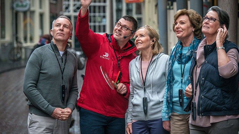 Local guide leading guests through the streets of Amsterdam; photo courtesy of Viking