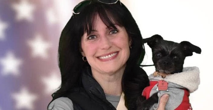 Executive Desk Travel Consultant Danielle Sword and her dog Socks