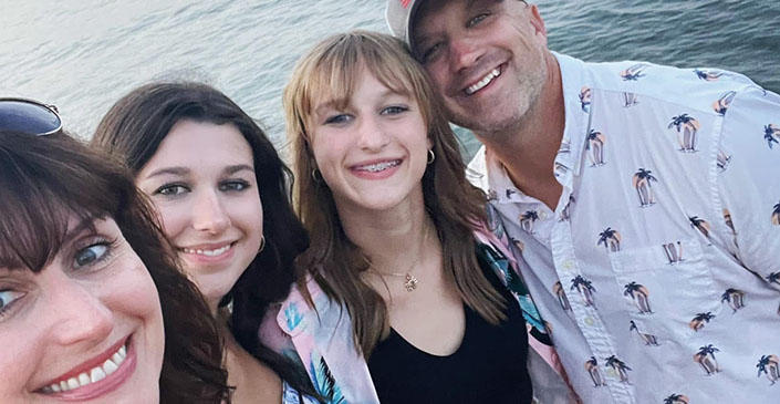 Executive Desk Travel Consultant Danielle Sword and her family