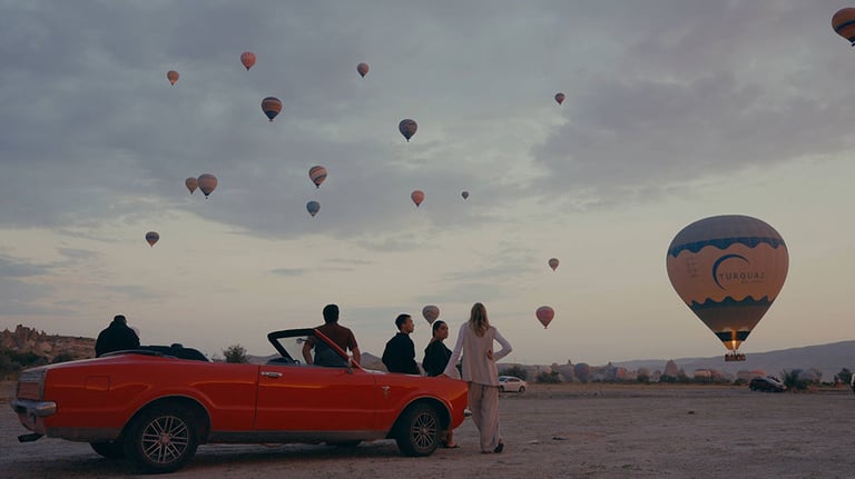 Friends together. watching balloons