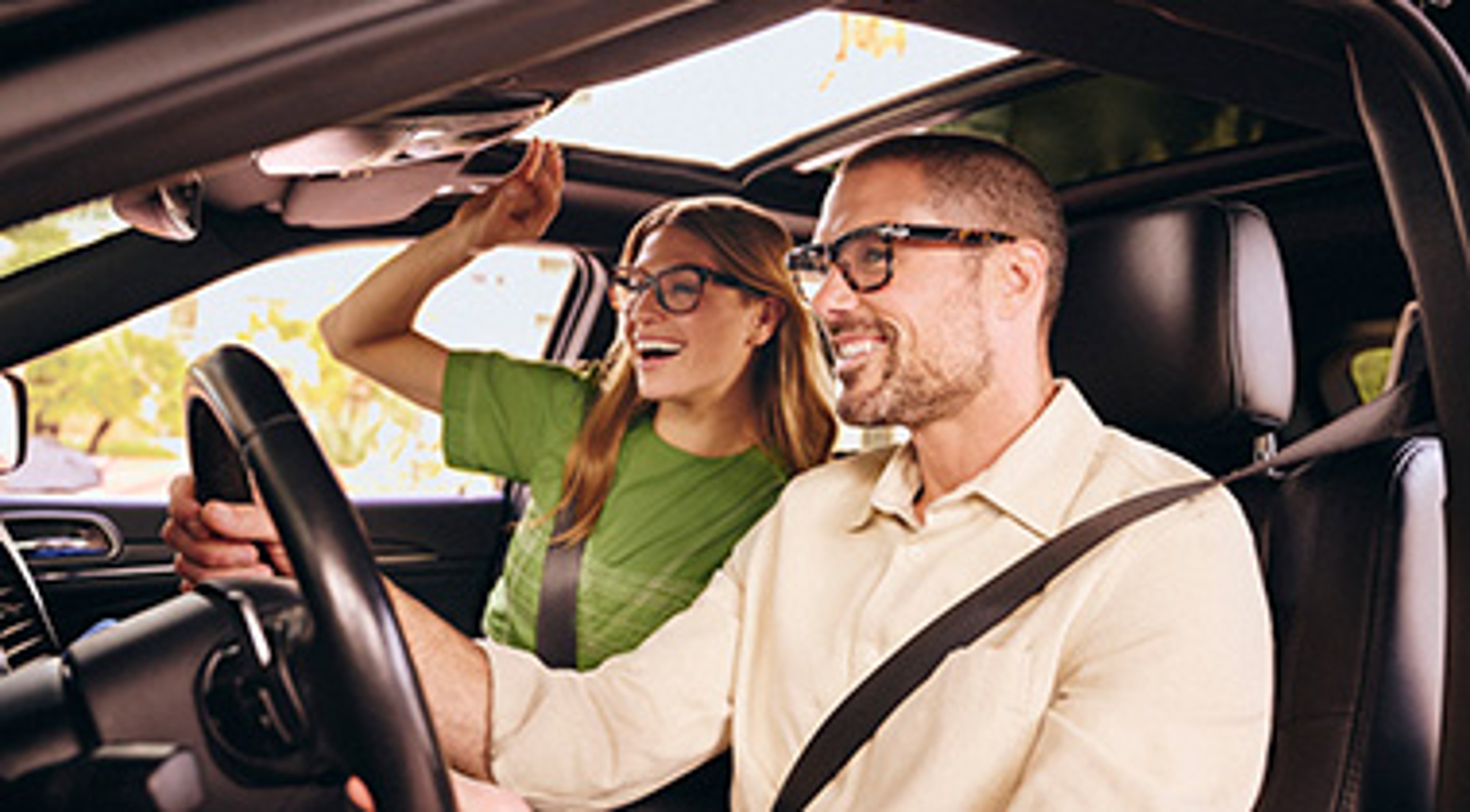 Happy couple on the road, wearing glasses