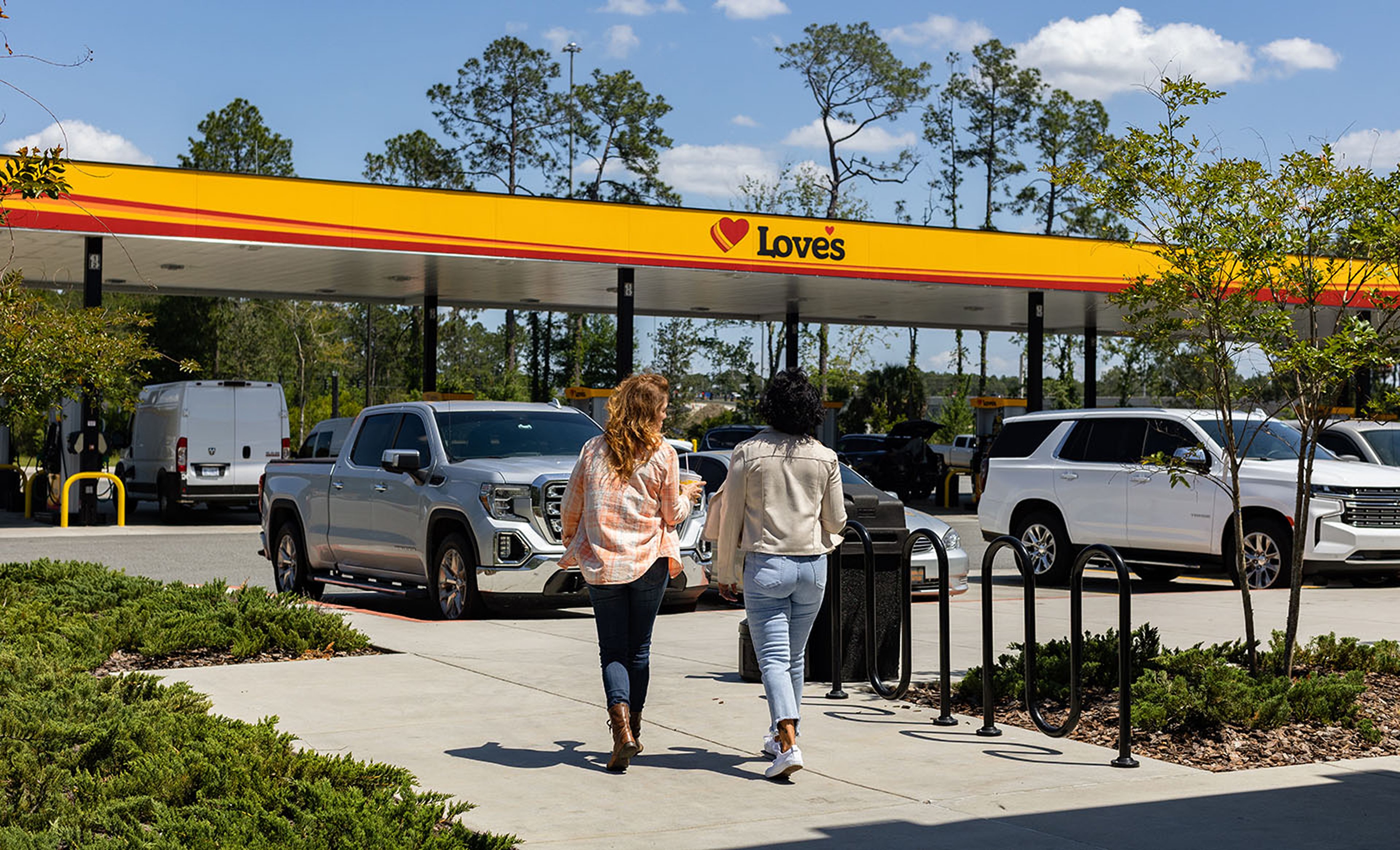 Women friends on roadtrip fueling up at Love's gas station