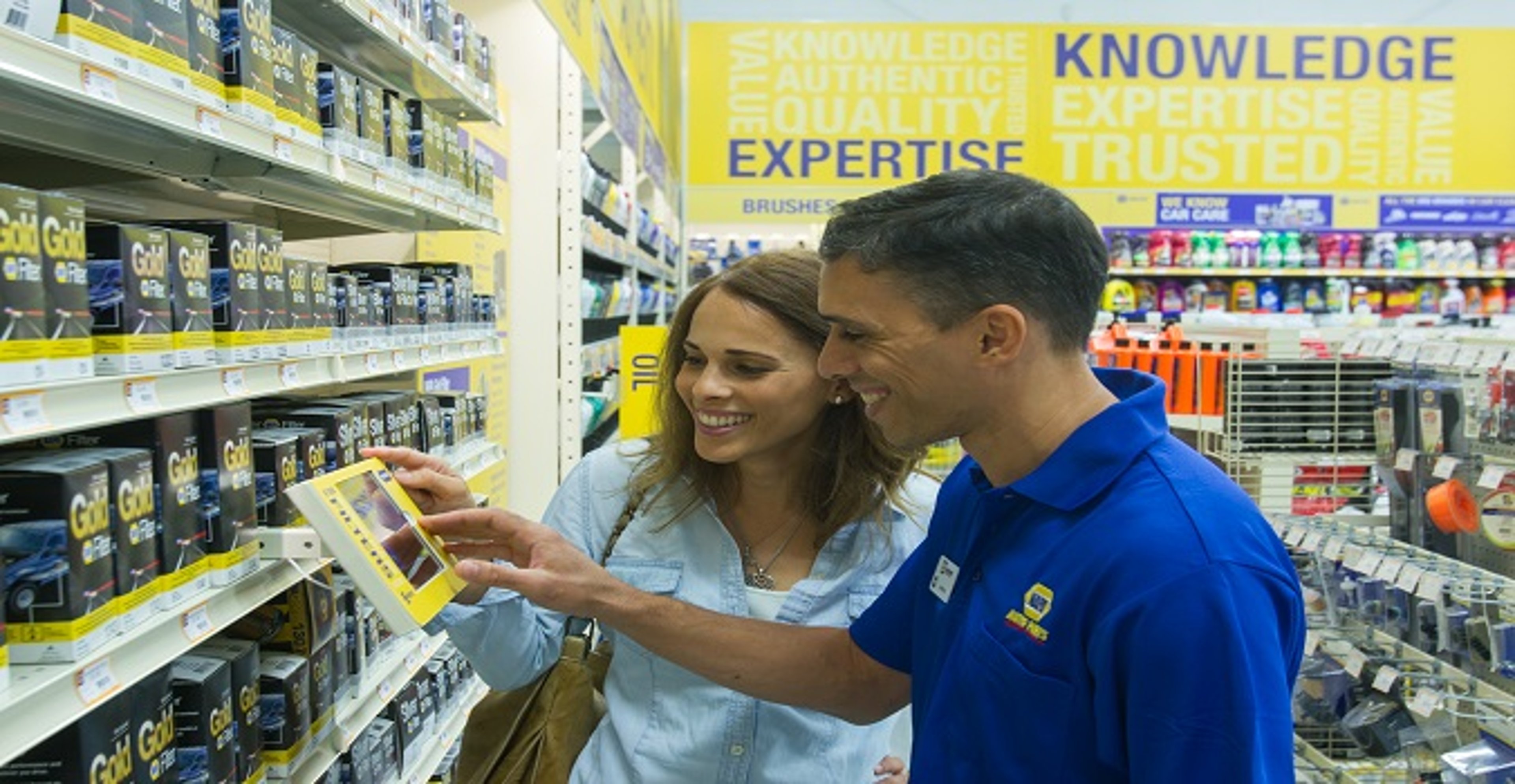 A Napa store associate assisting a customer in a Napa store aisle