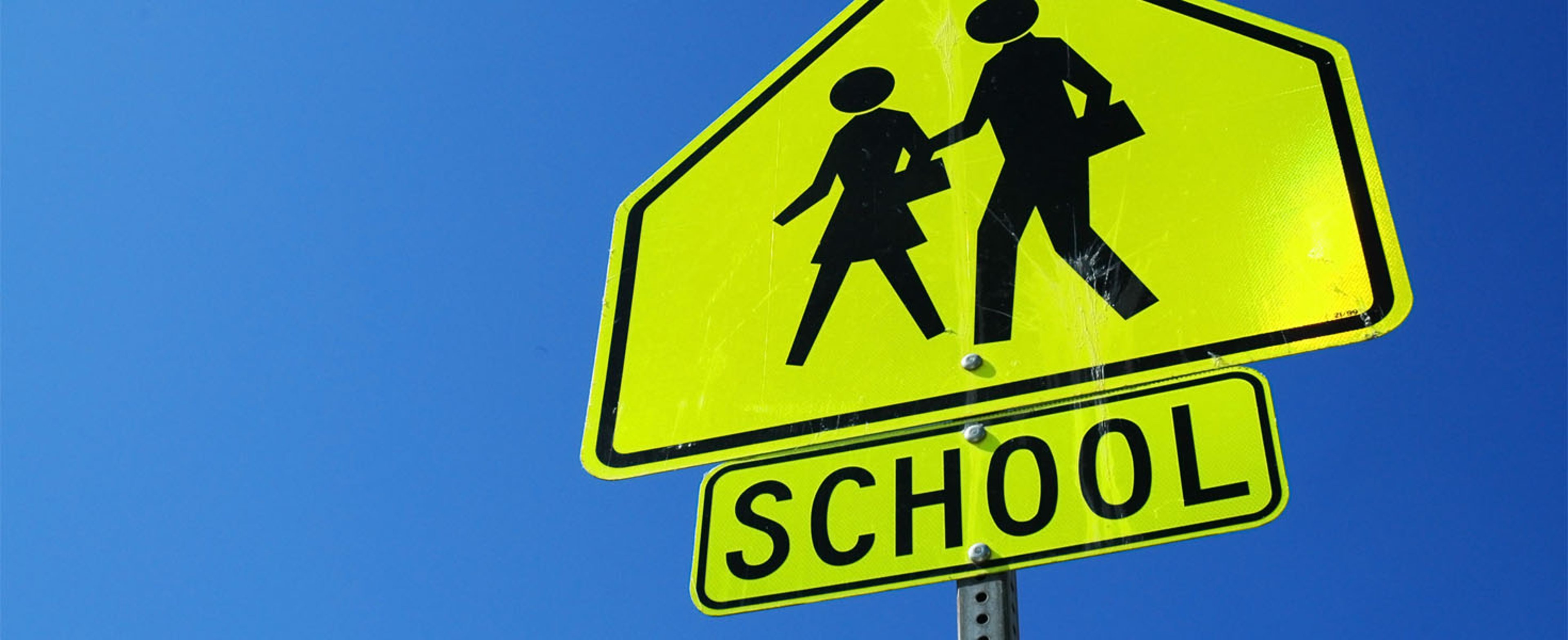 Caution school sign, blue sky