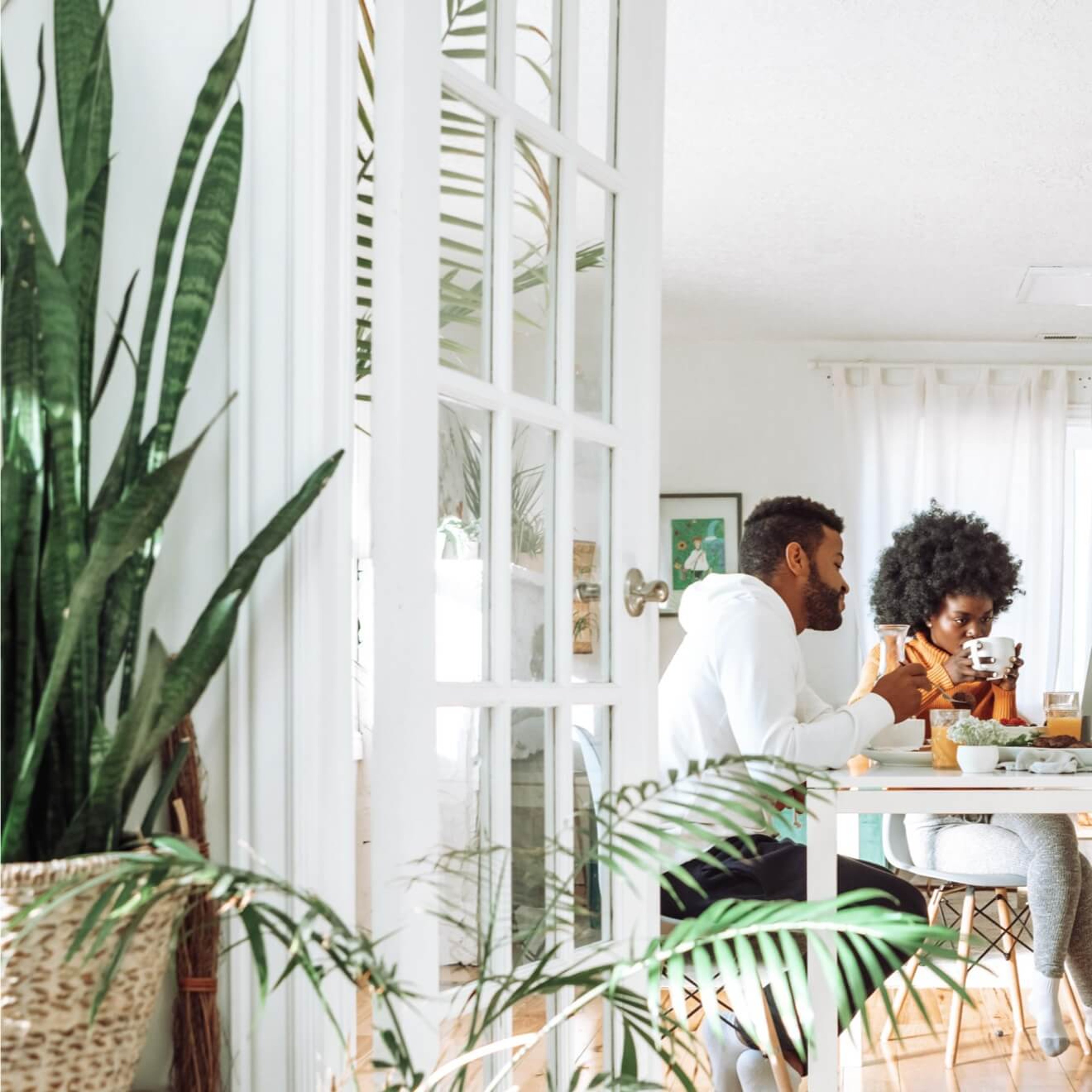 Family sitting at table enjoying breakfast