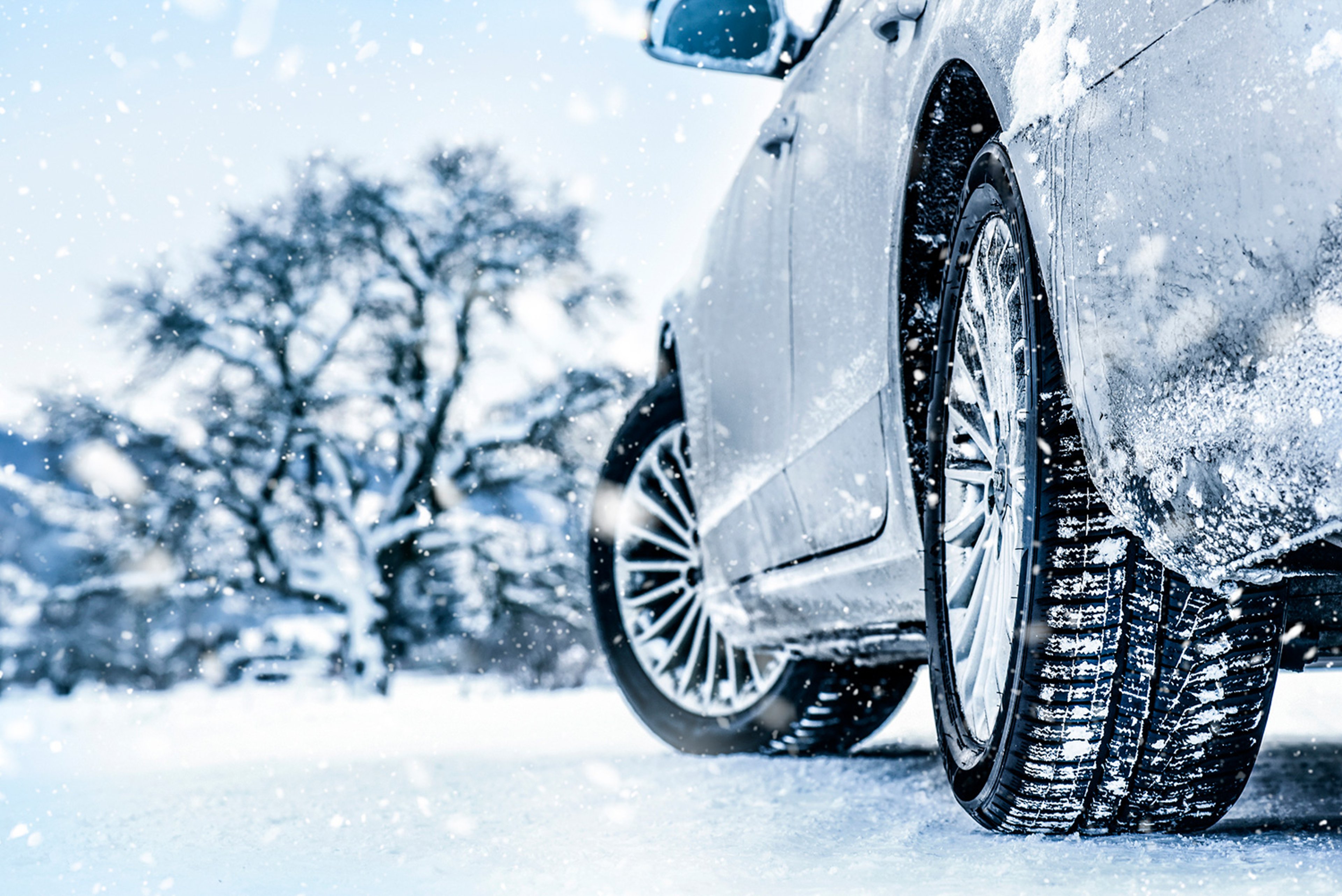 Close up of car tires on a snowy road