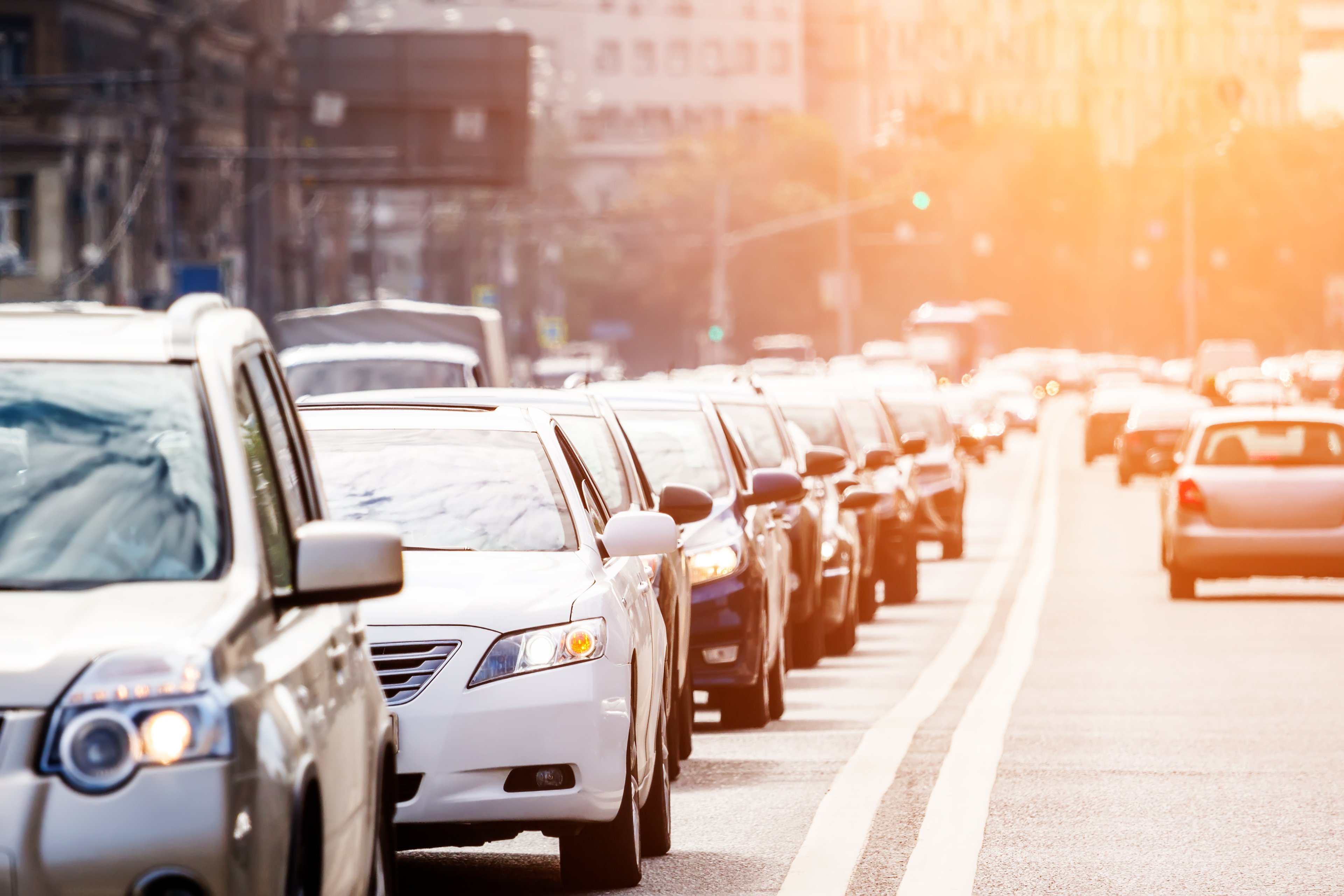 Cars on two lane urban road in traffic