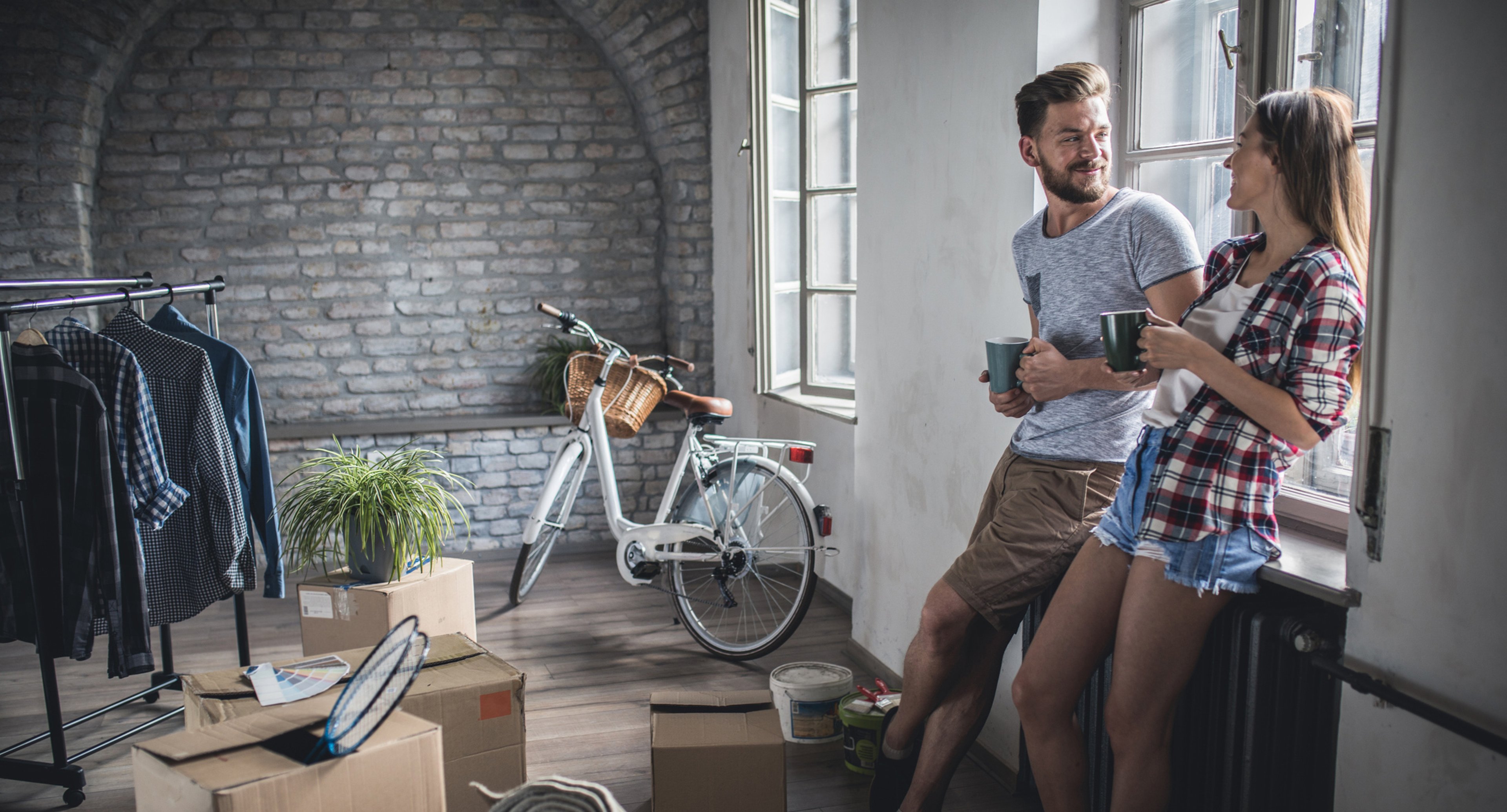 Couple smiling in their new apartment