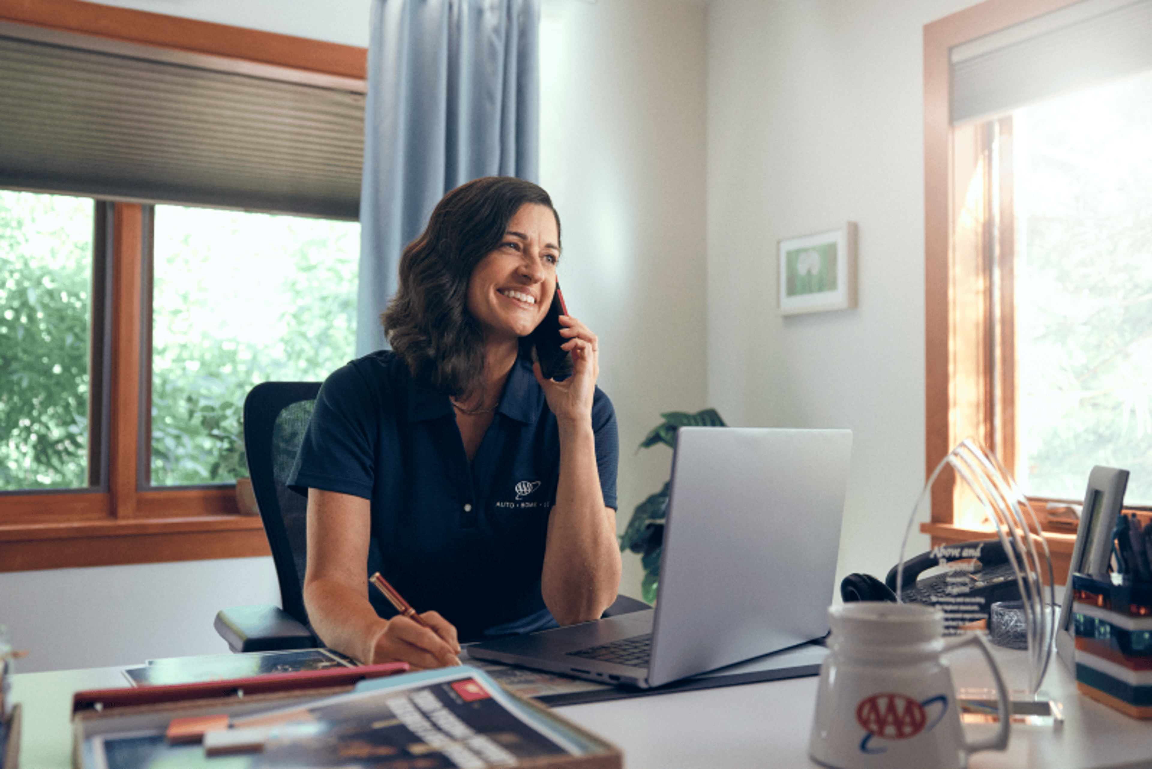 Agent at desk smiling