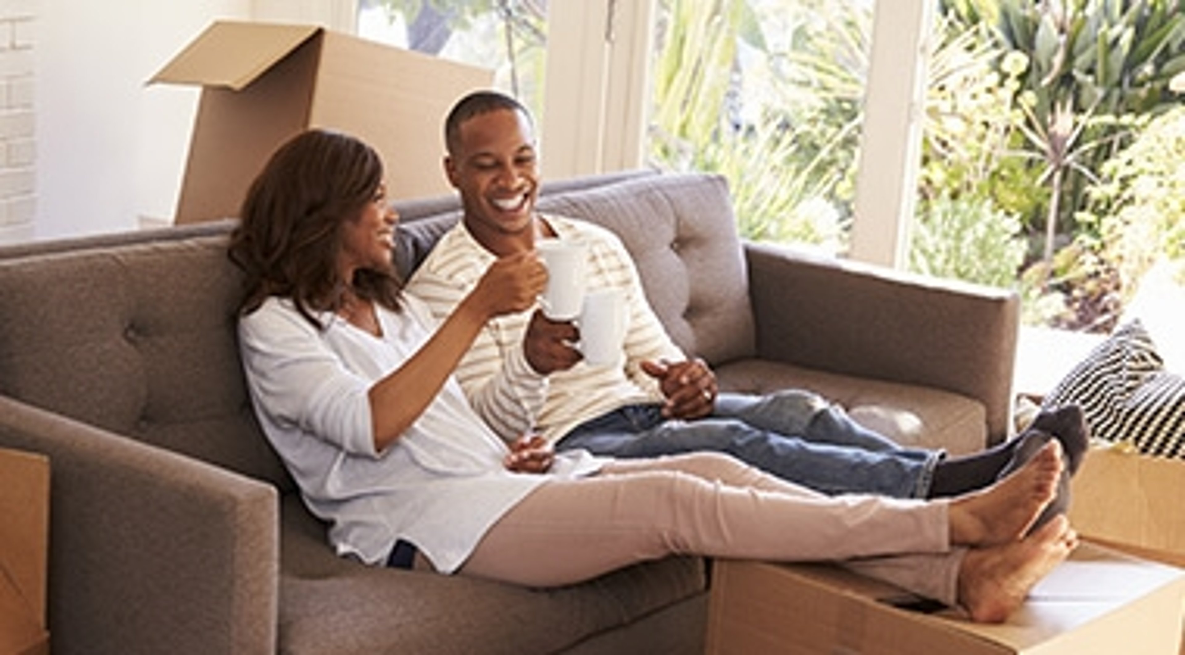 Husband and wife taking a break on moving day 