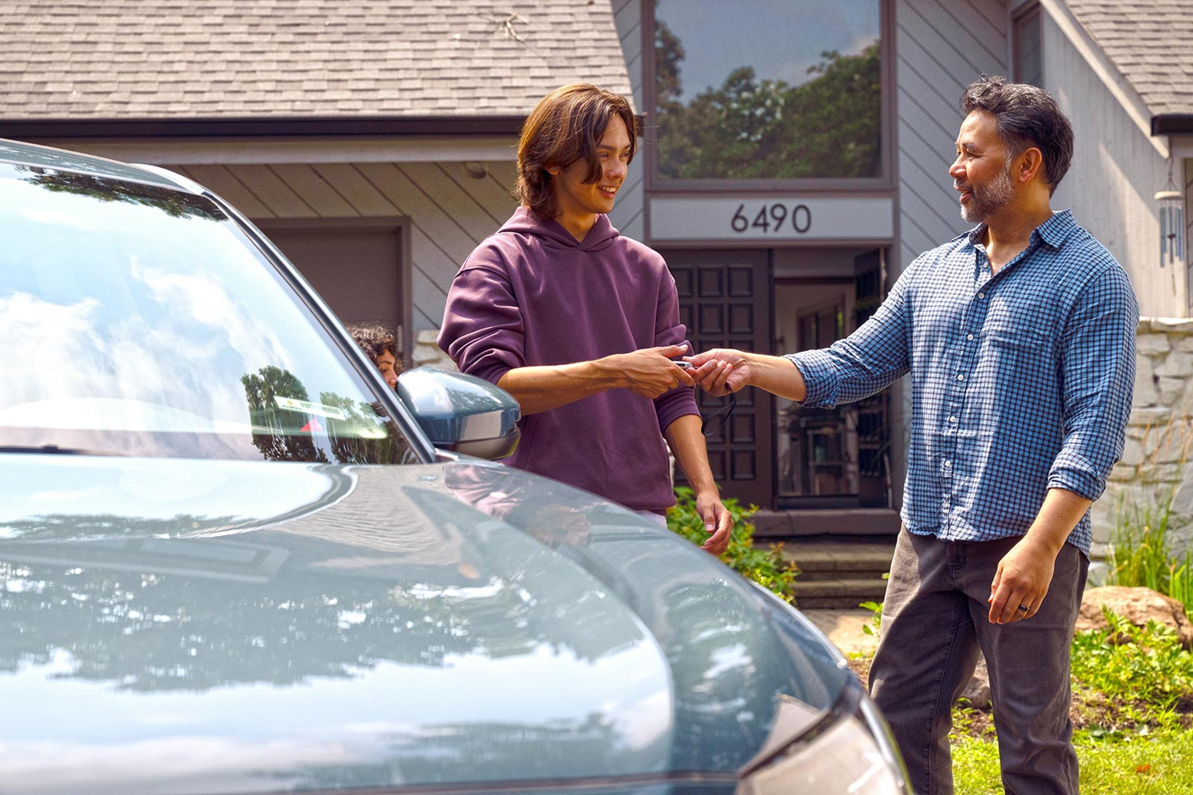 Father and son in their driveway 