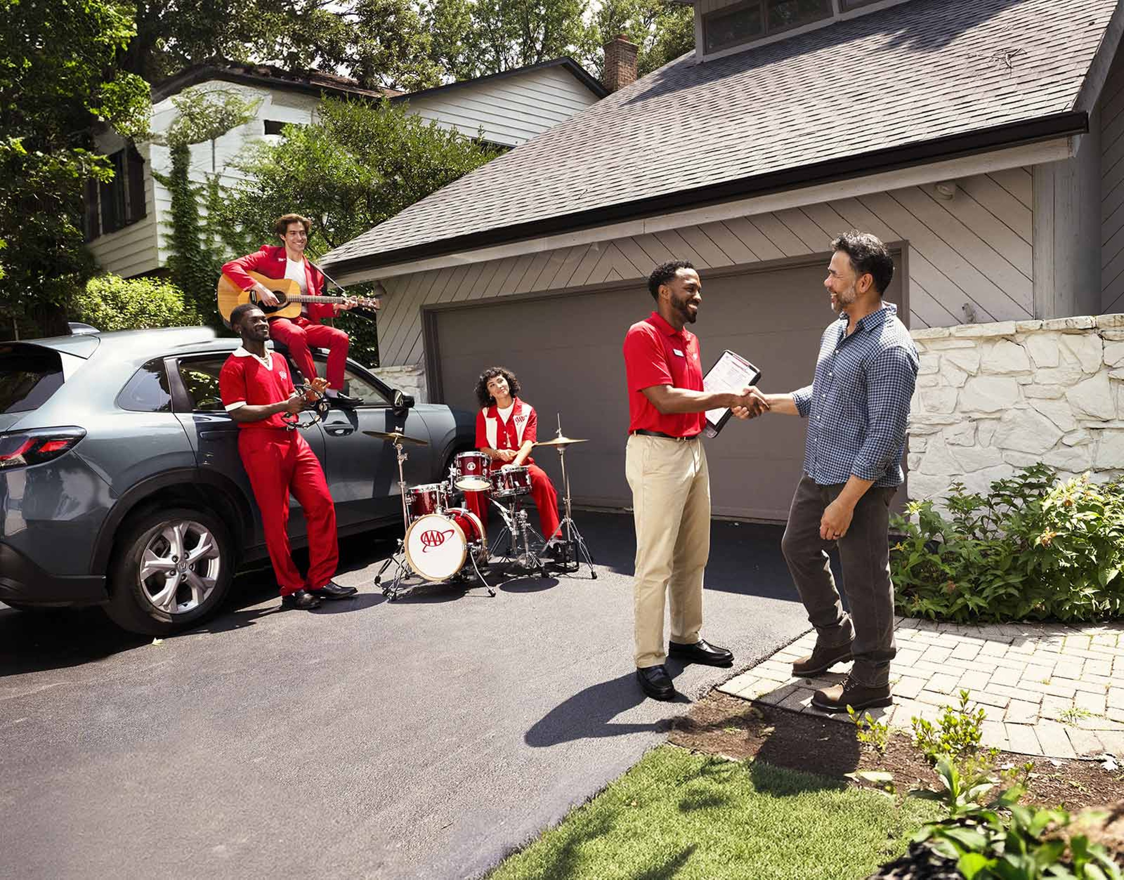 Father and son in the driveway with band playing