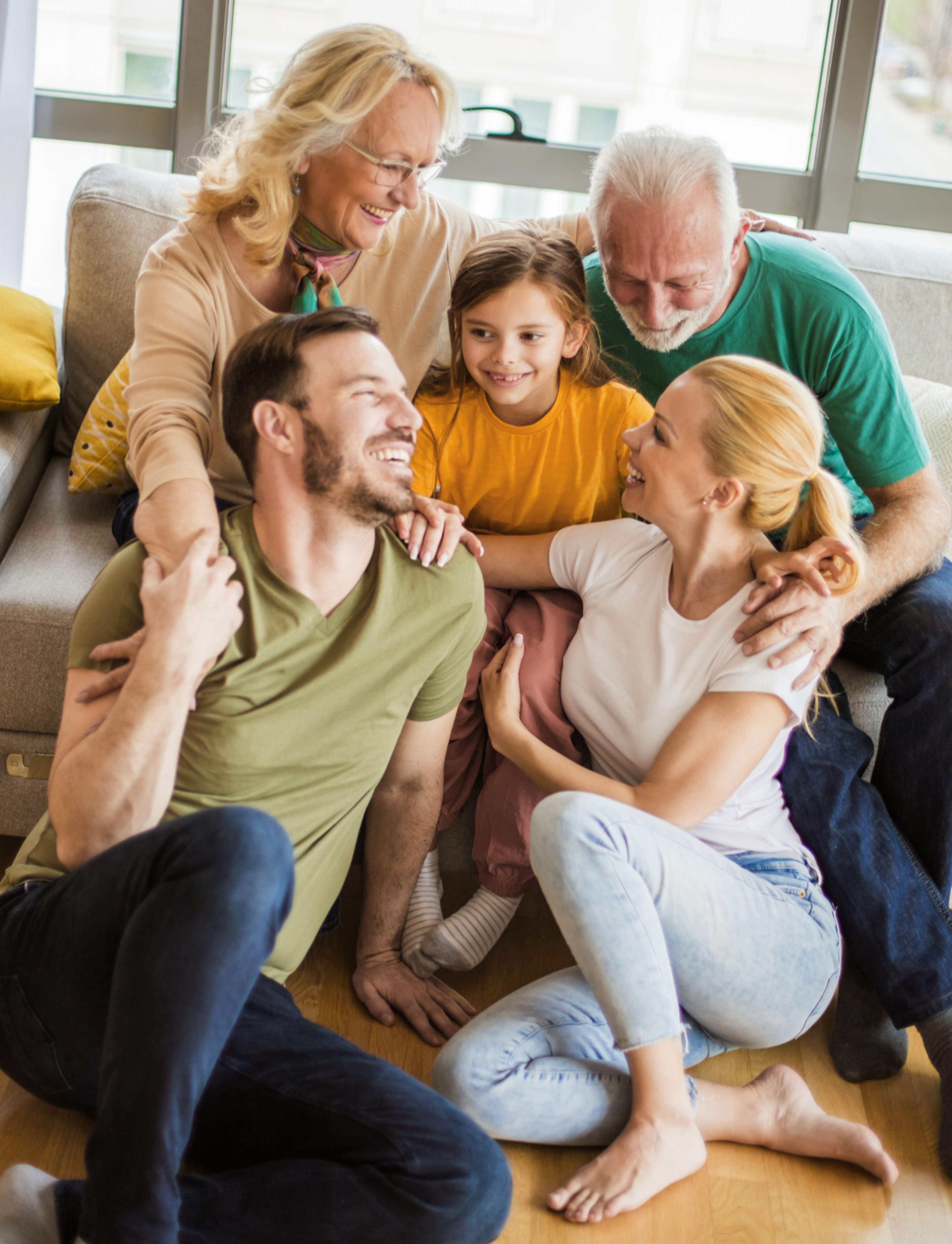 Three generations of family relaxing together at home