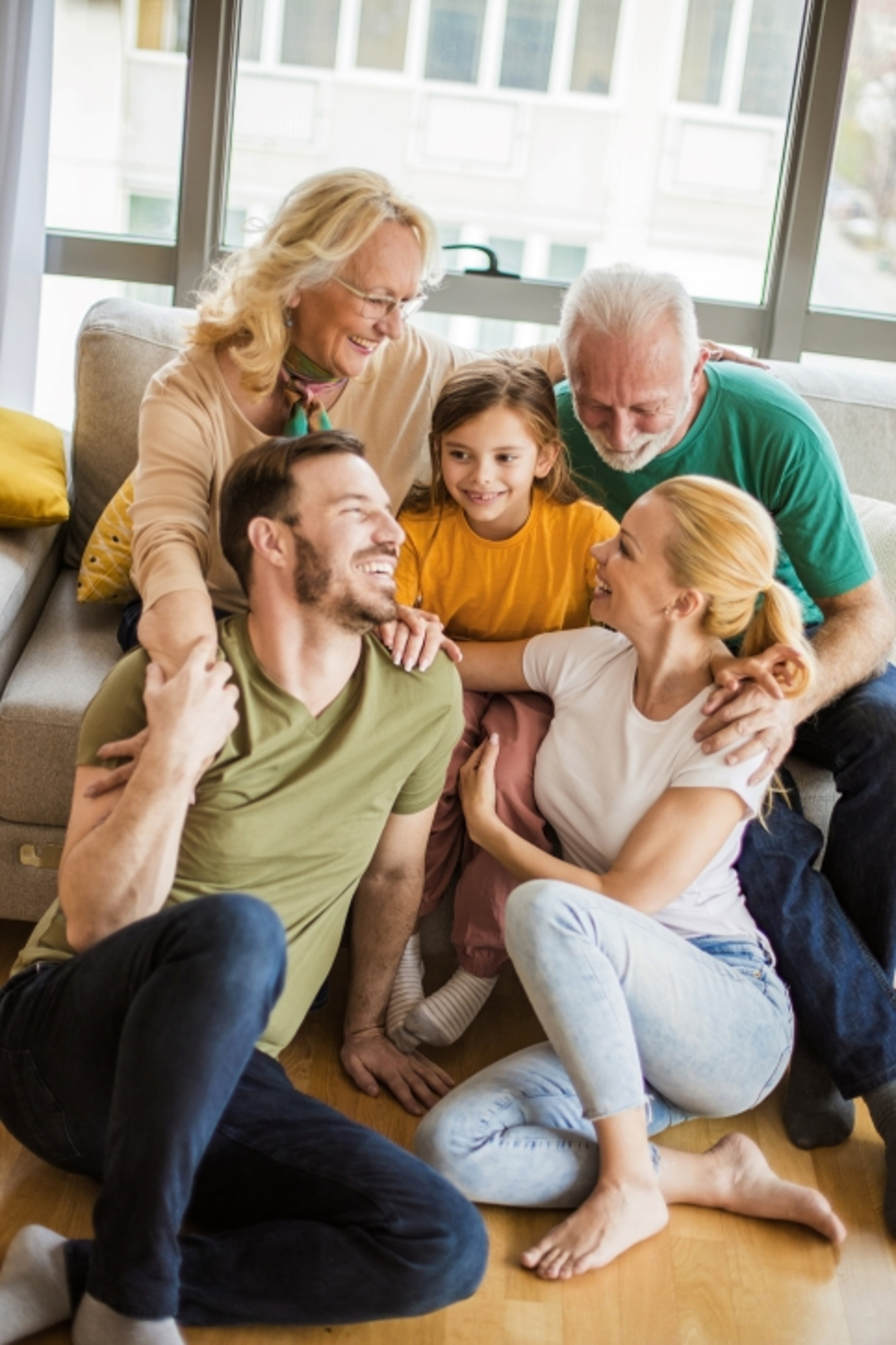 Multigenerational family together in living room
