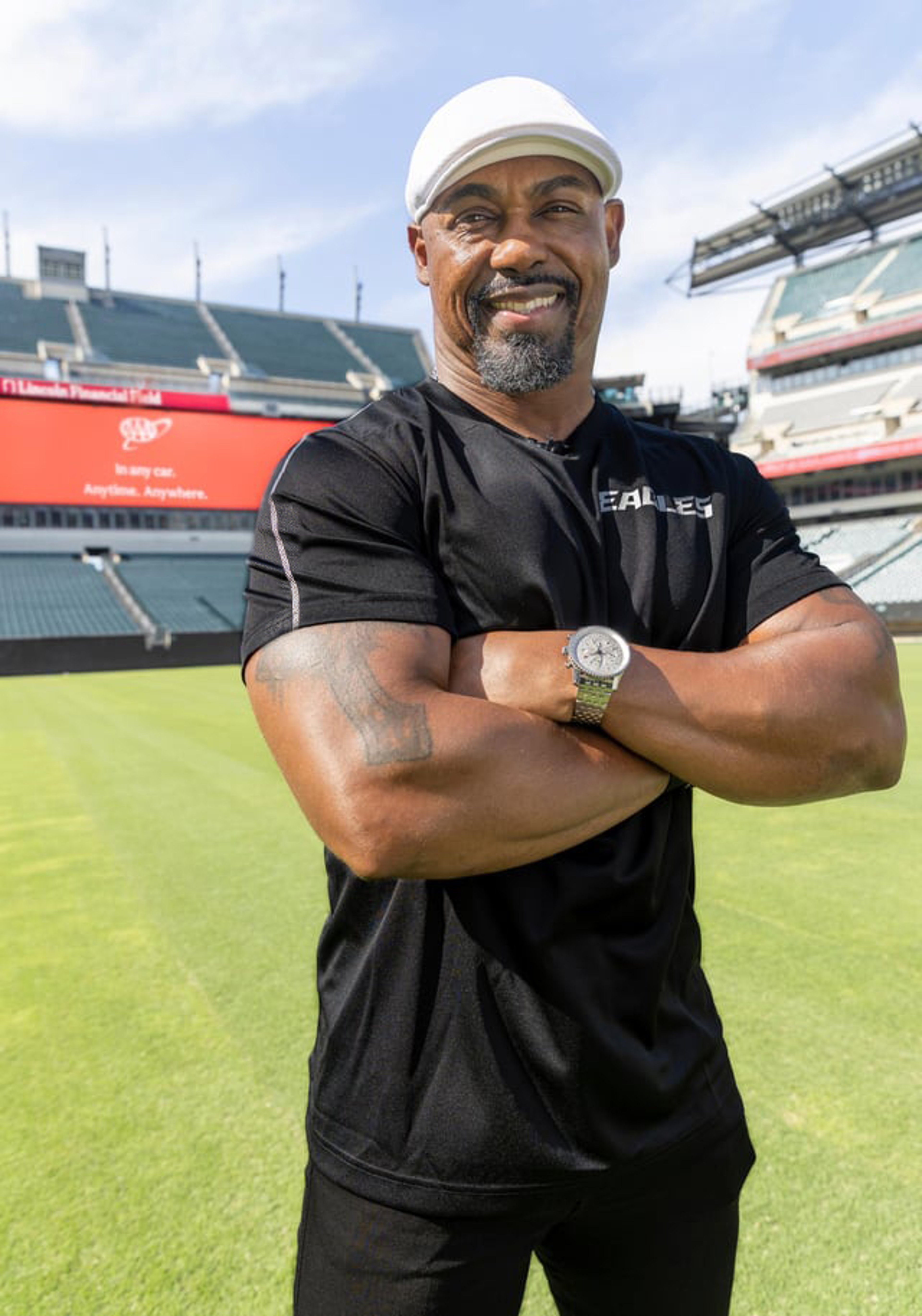 Philadelphia Eagles Legend Brian Dawkins standing on the football field