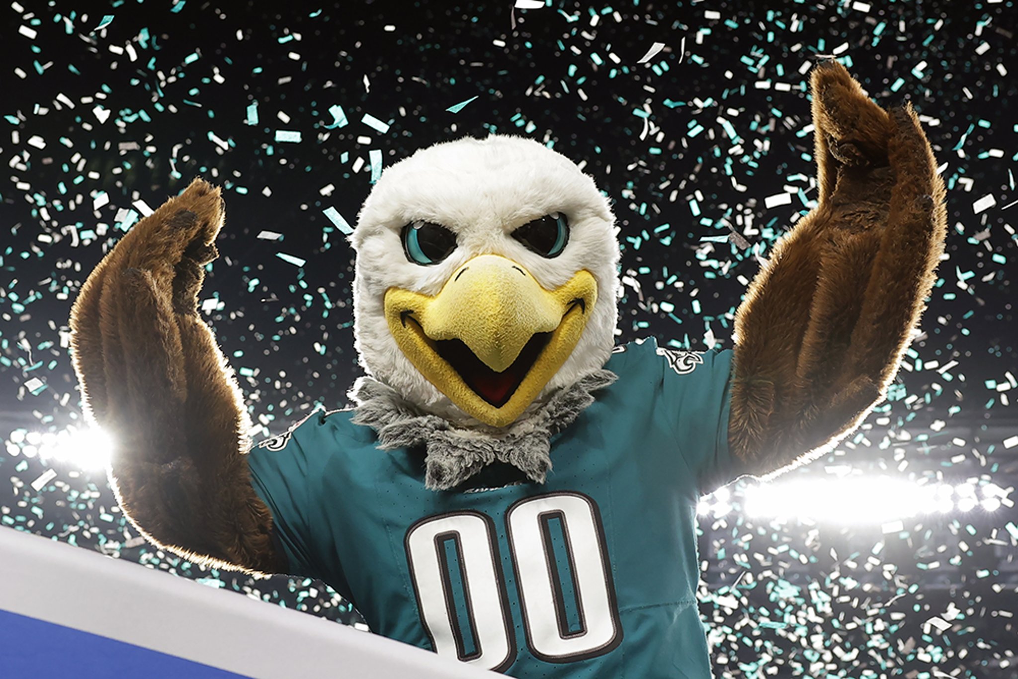 Philadelphia Eagles mascot Swoop with arms raised in triumph while confetti showers around him after the Eagles victory in the 2024 season NFC championship game