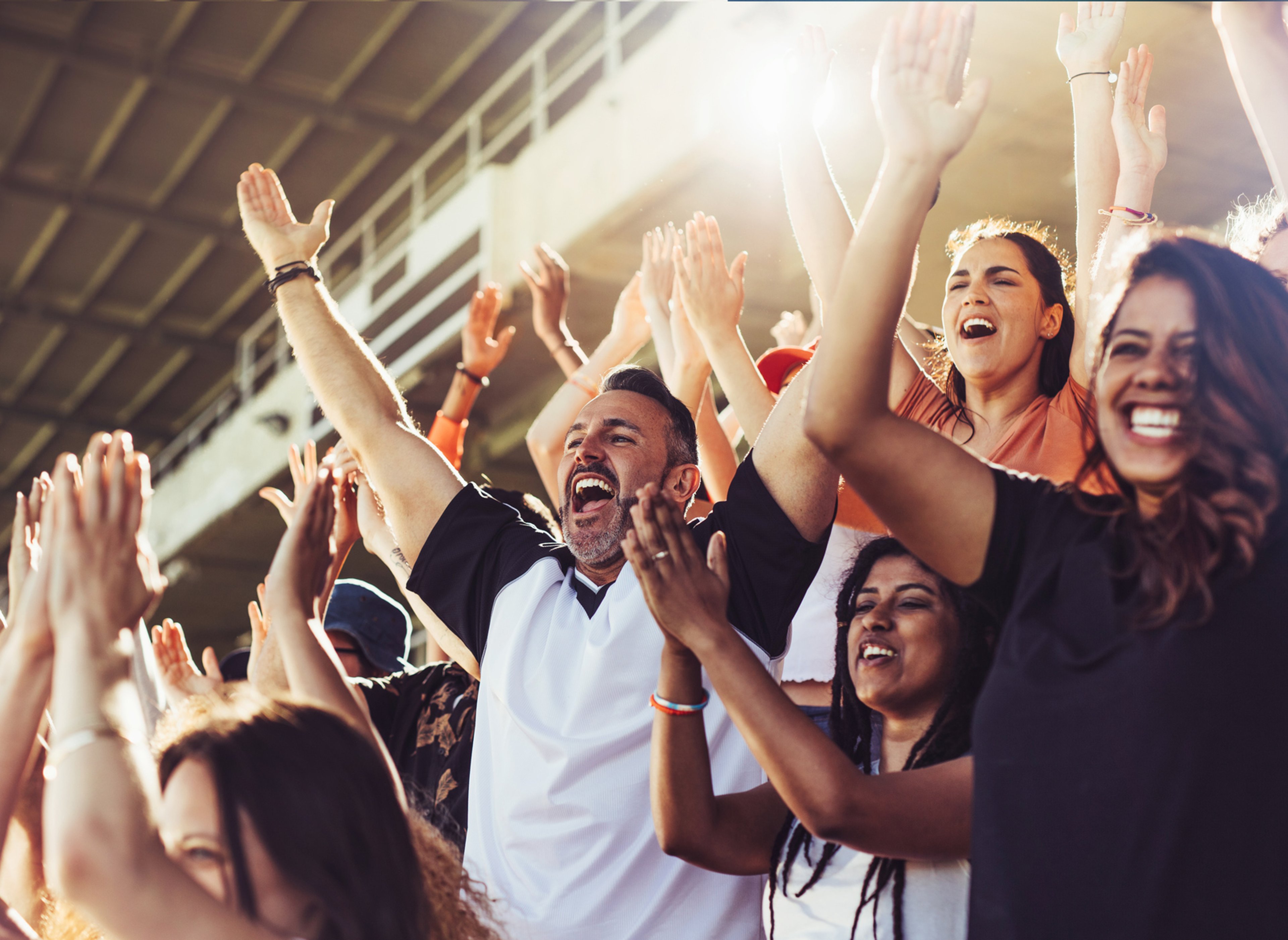 Close up of happy, cheering fans at a sporting event