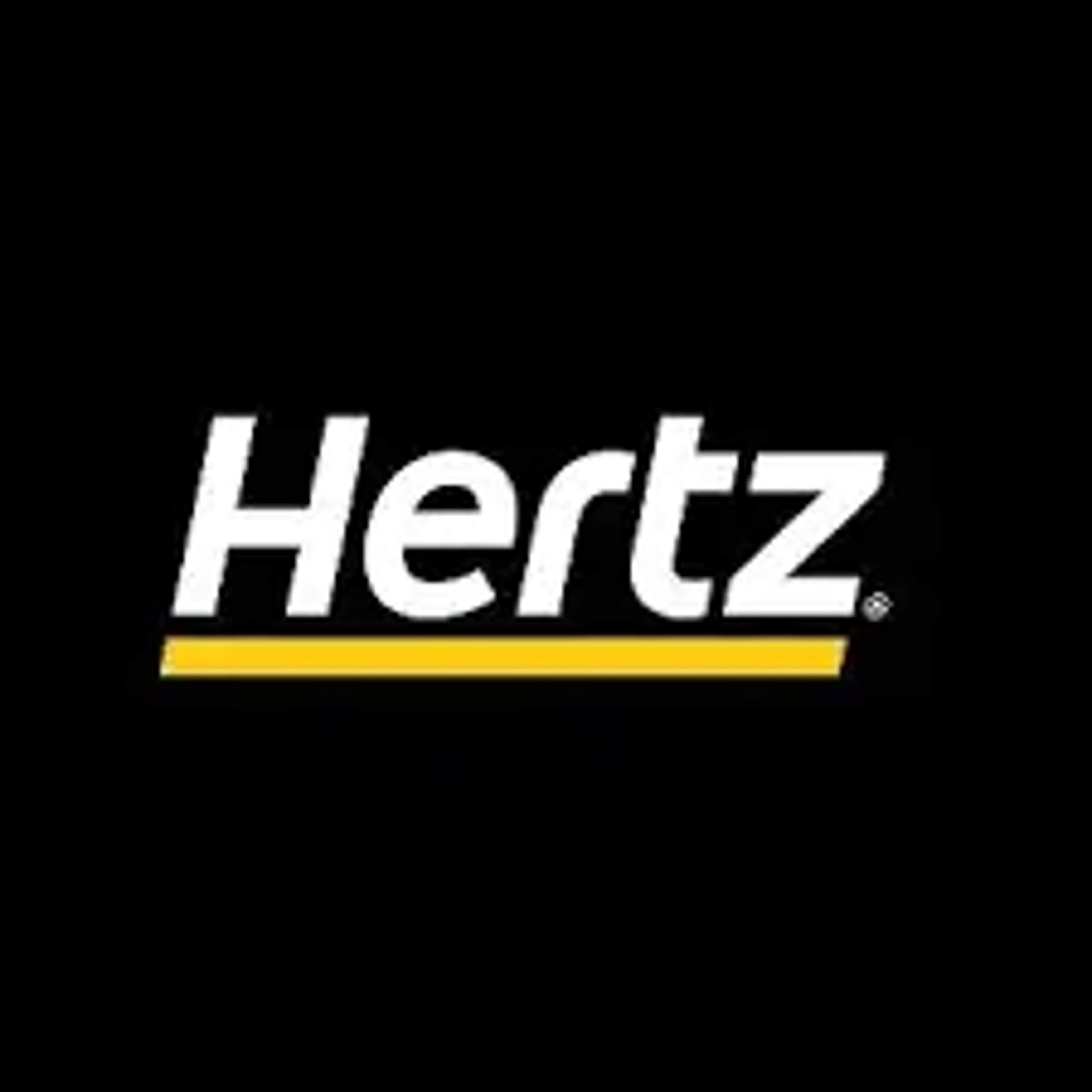 Hertz logo displaying the white italicized word "Hertz" with a yellow accent line underneath on a solid black background.