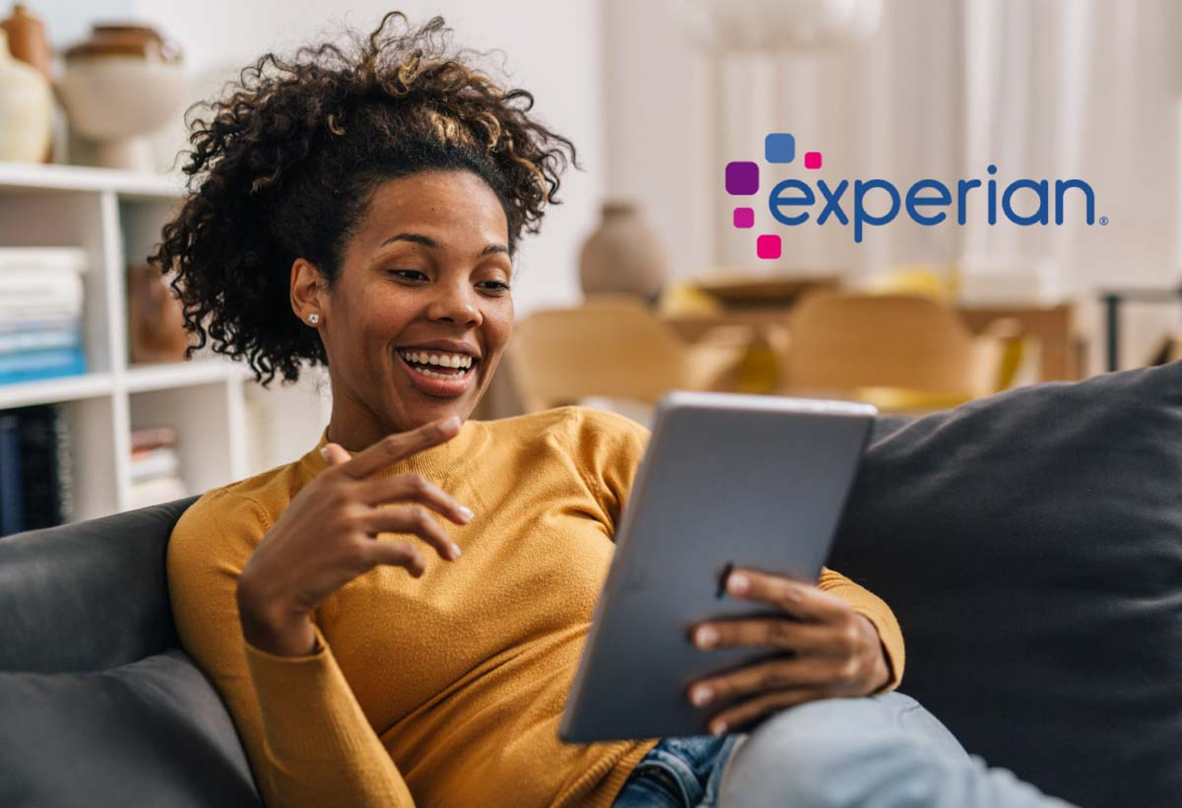 Woman on tablet and the Experian logo