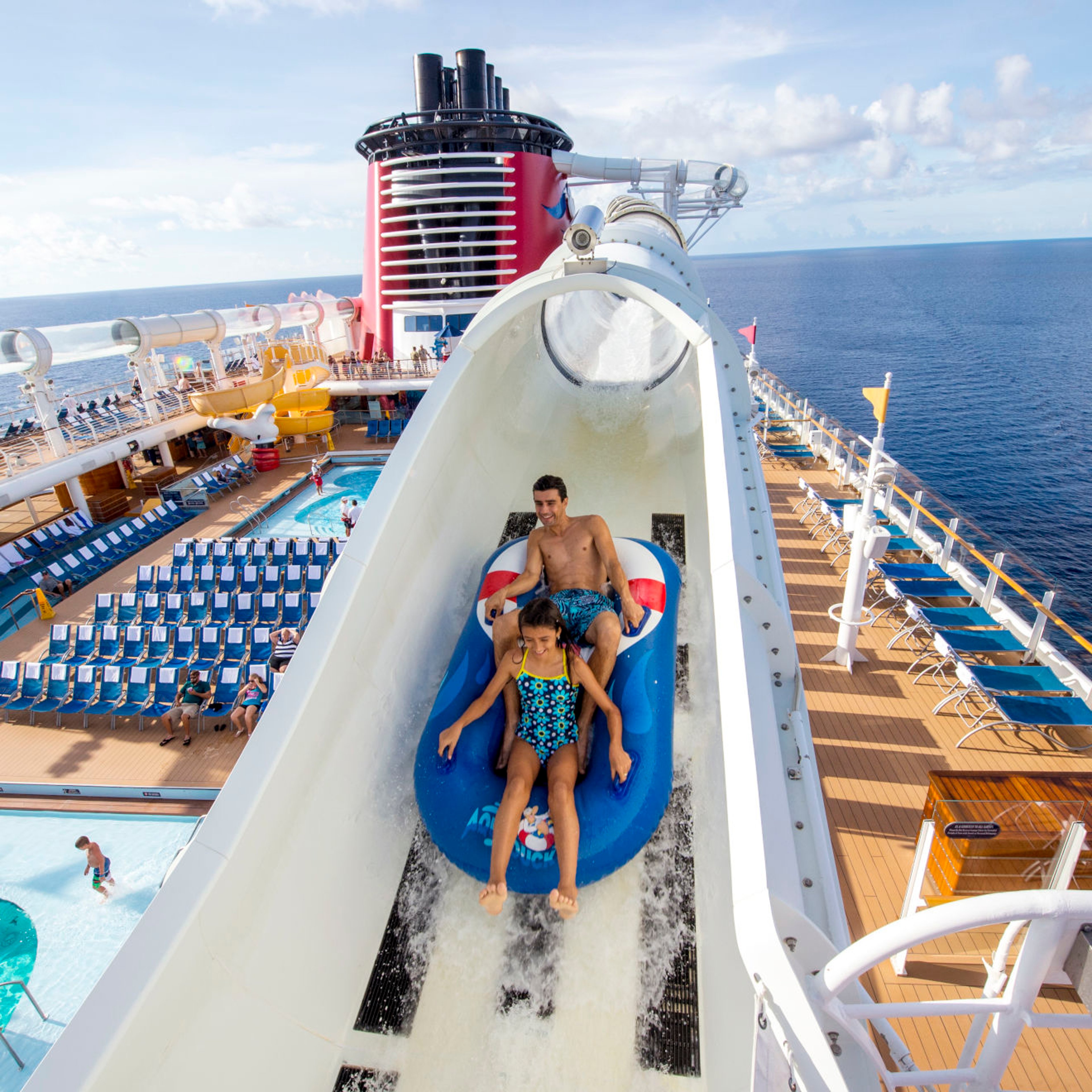 Family riding Disney cruise coaster water slide