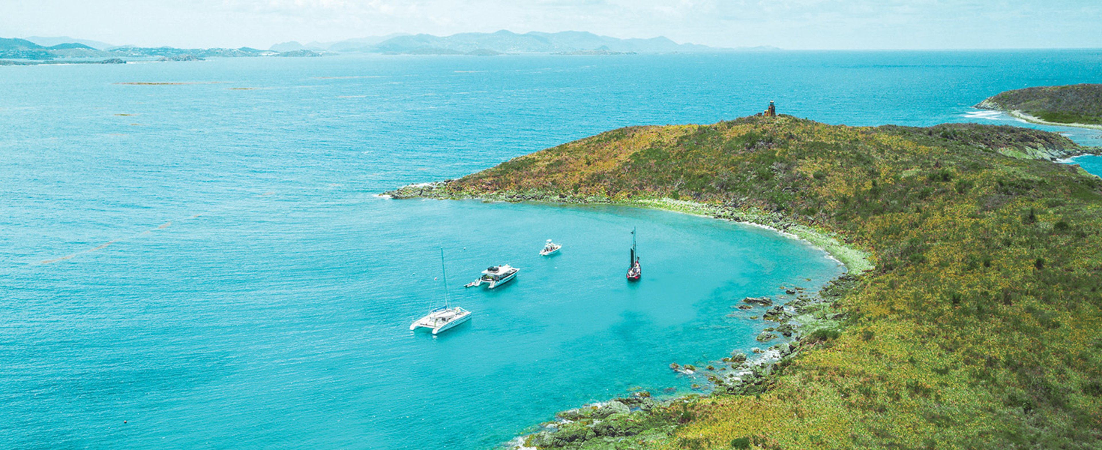 The image shows Christmas Cove, a sheltered bay located off the coast of Great St. James Island near St. Thomas in the U.S. Virgin Islands