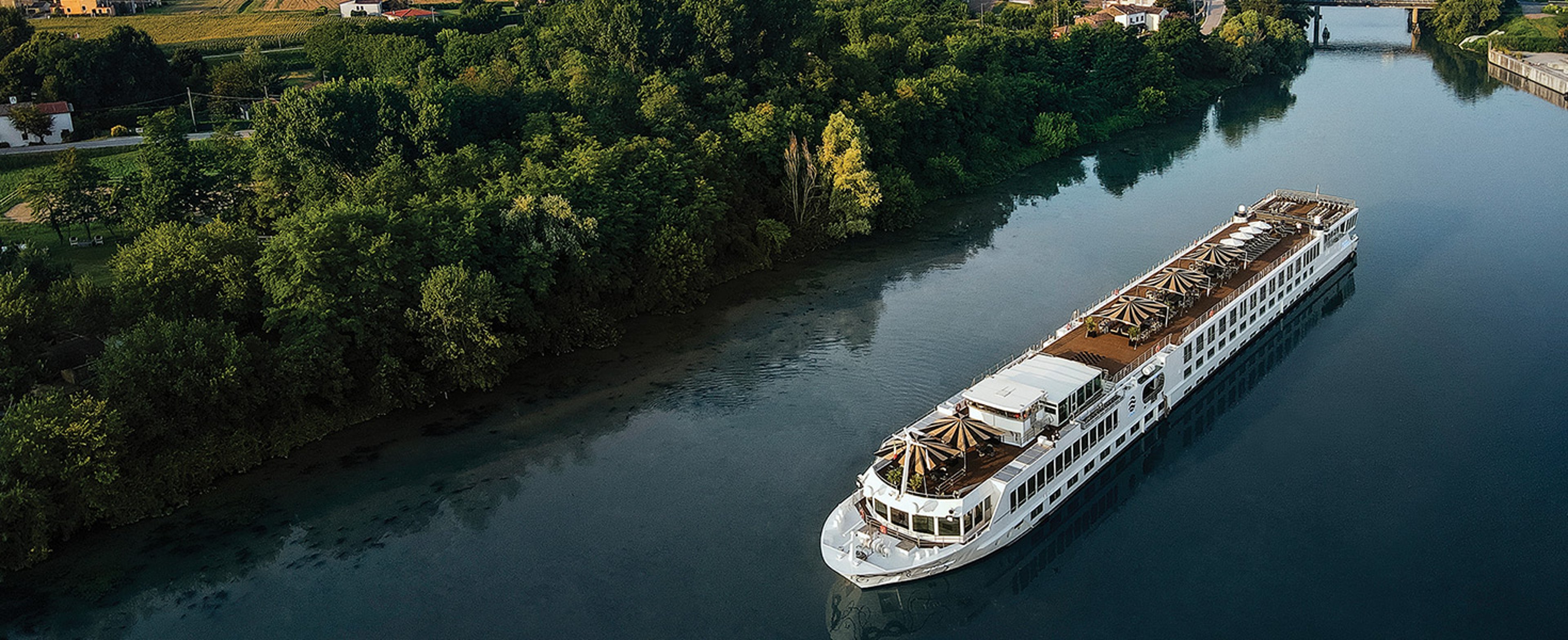 The image appears to show the S.S. La Venezia, a luxury river cruise ship operated by Uniworld Boutique River Cruises