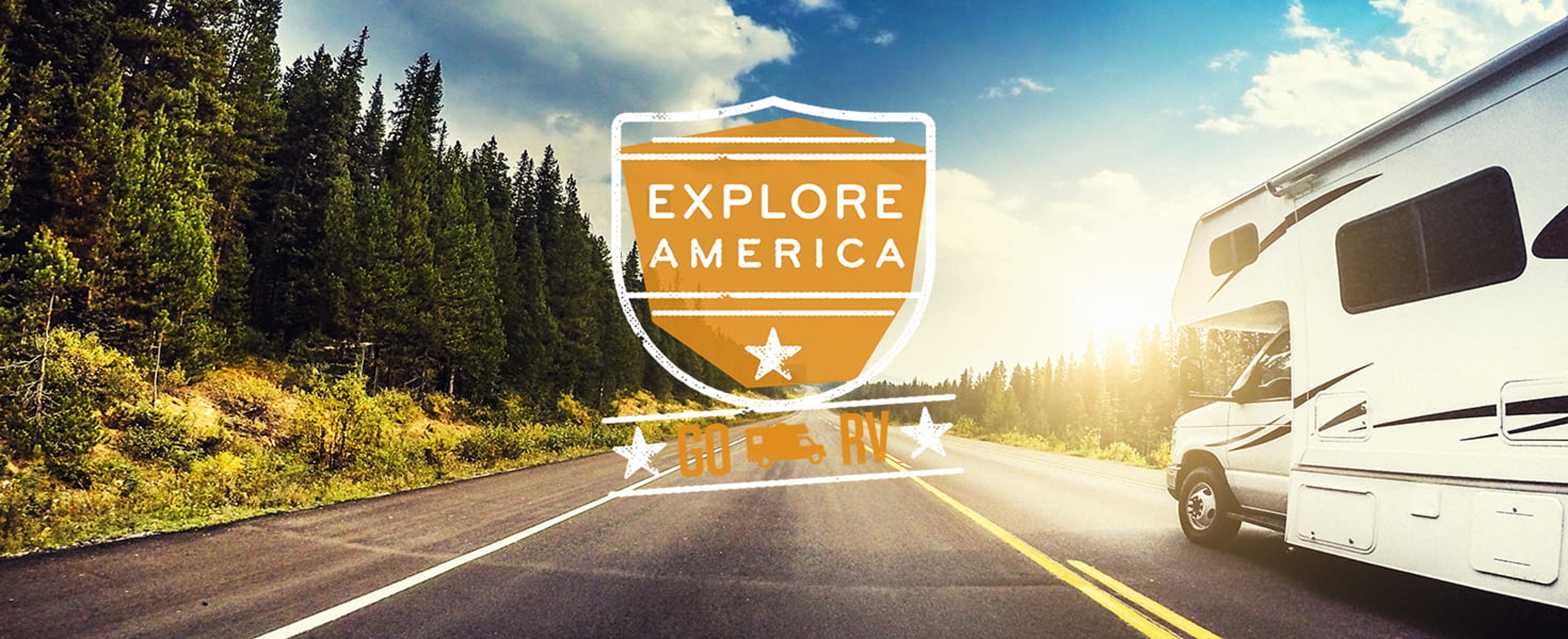 Orange Explore America Go RV shield logo with white RV cruising along tree-lined highway