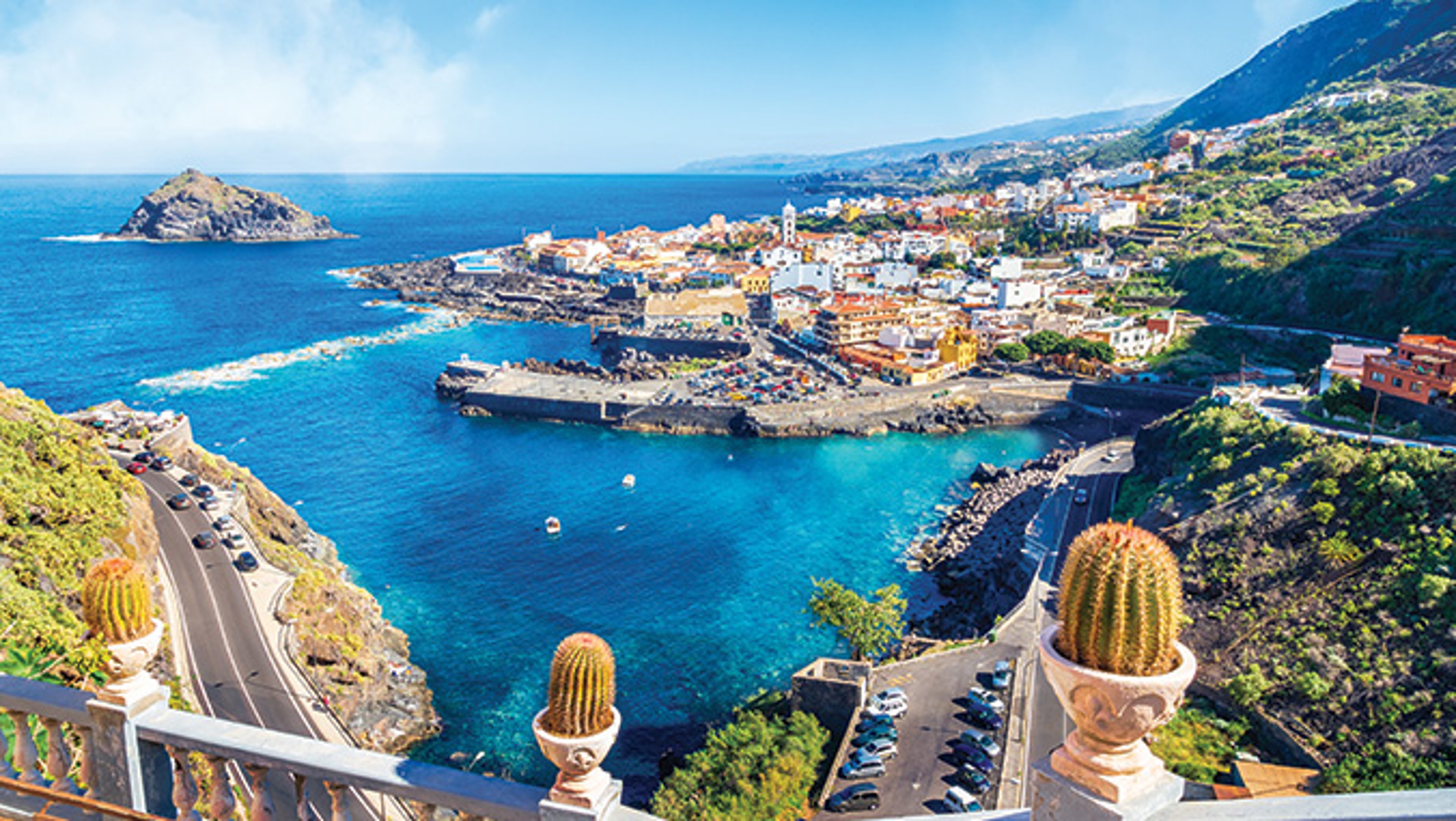 Stone railing overlooking coast and bay in Tenerife, Spain