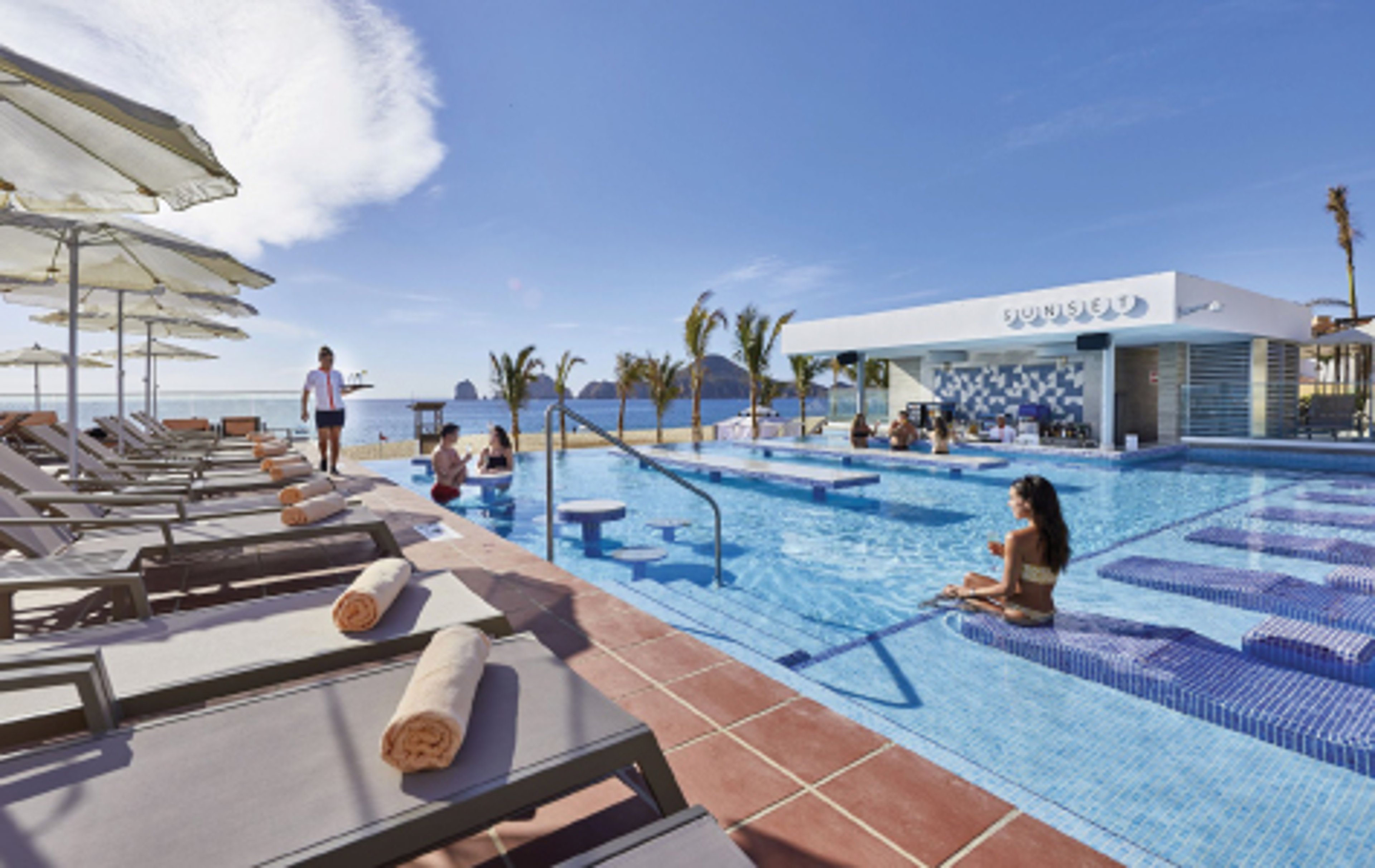 Infinity pool with people in it at a resort in Mexico