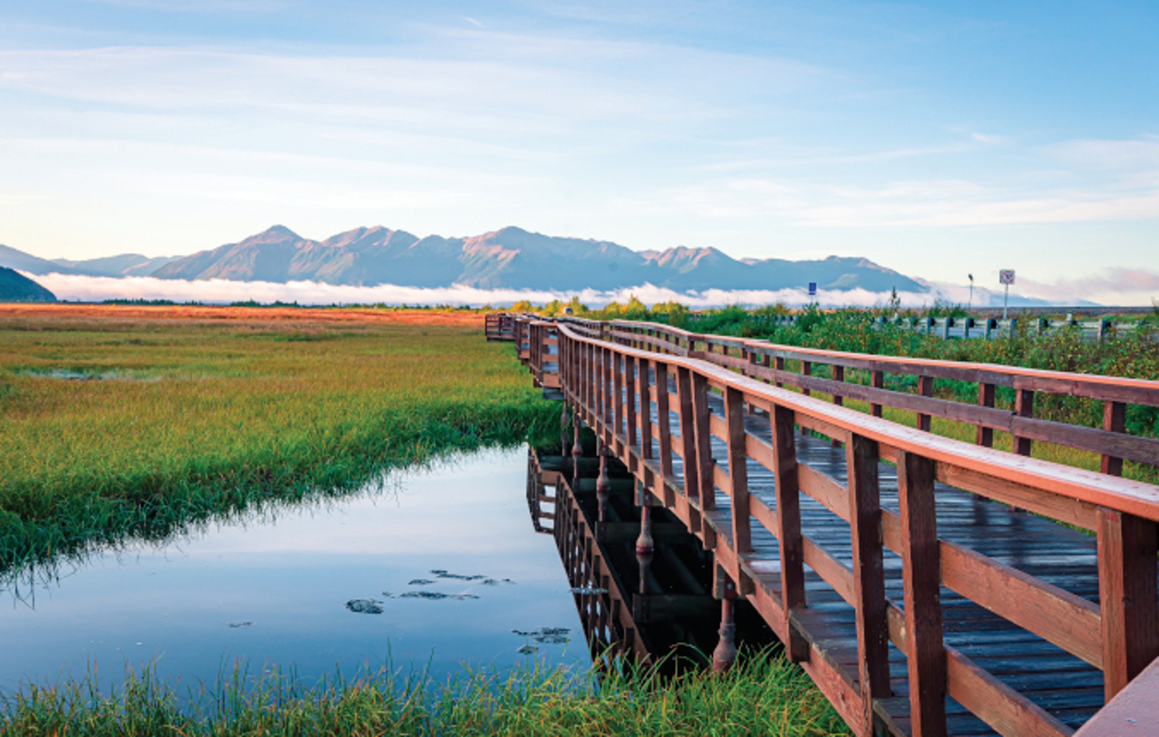 A wooden boardwalk in Potter Marsh Bird Sanctuary, Alaska