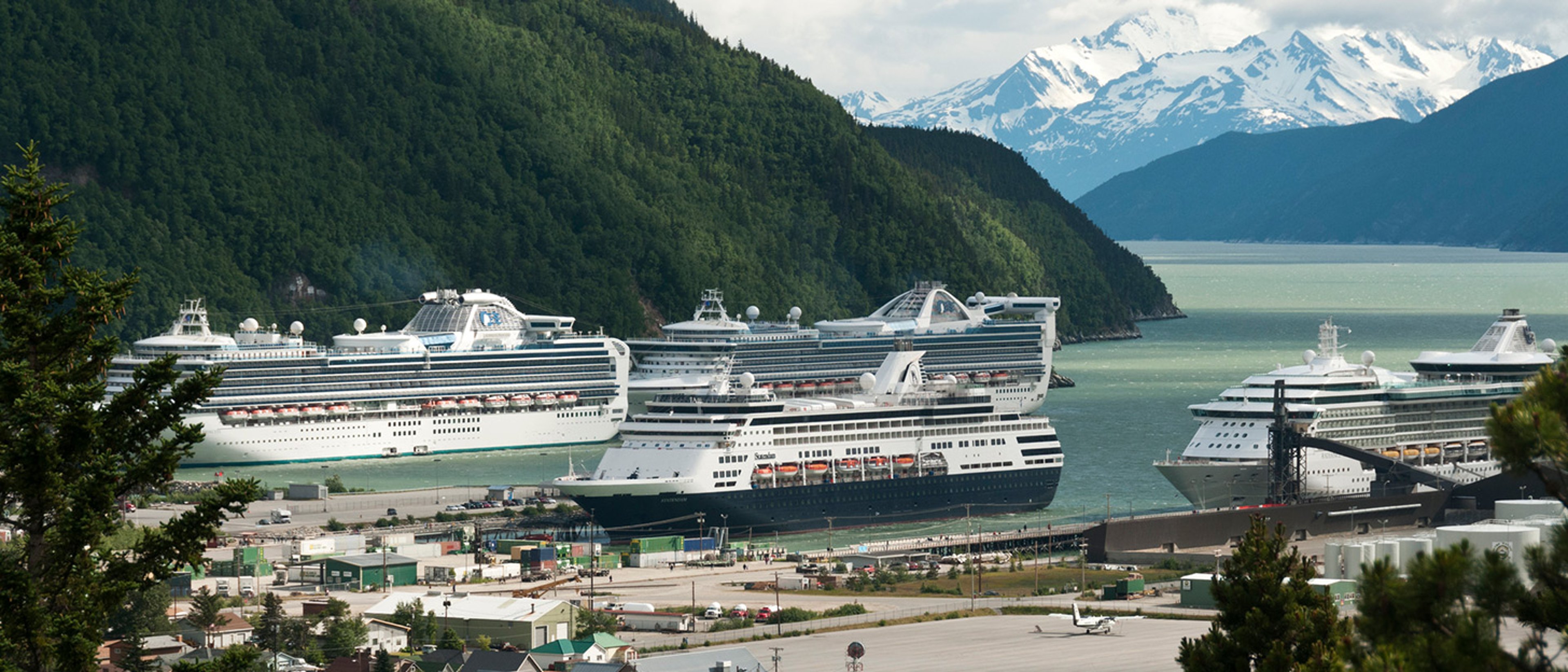Multiple cruise ships docked at the Skagway Cruise Terminal in Alaska.