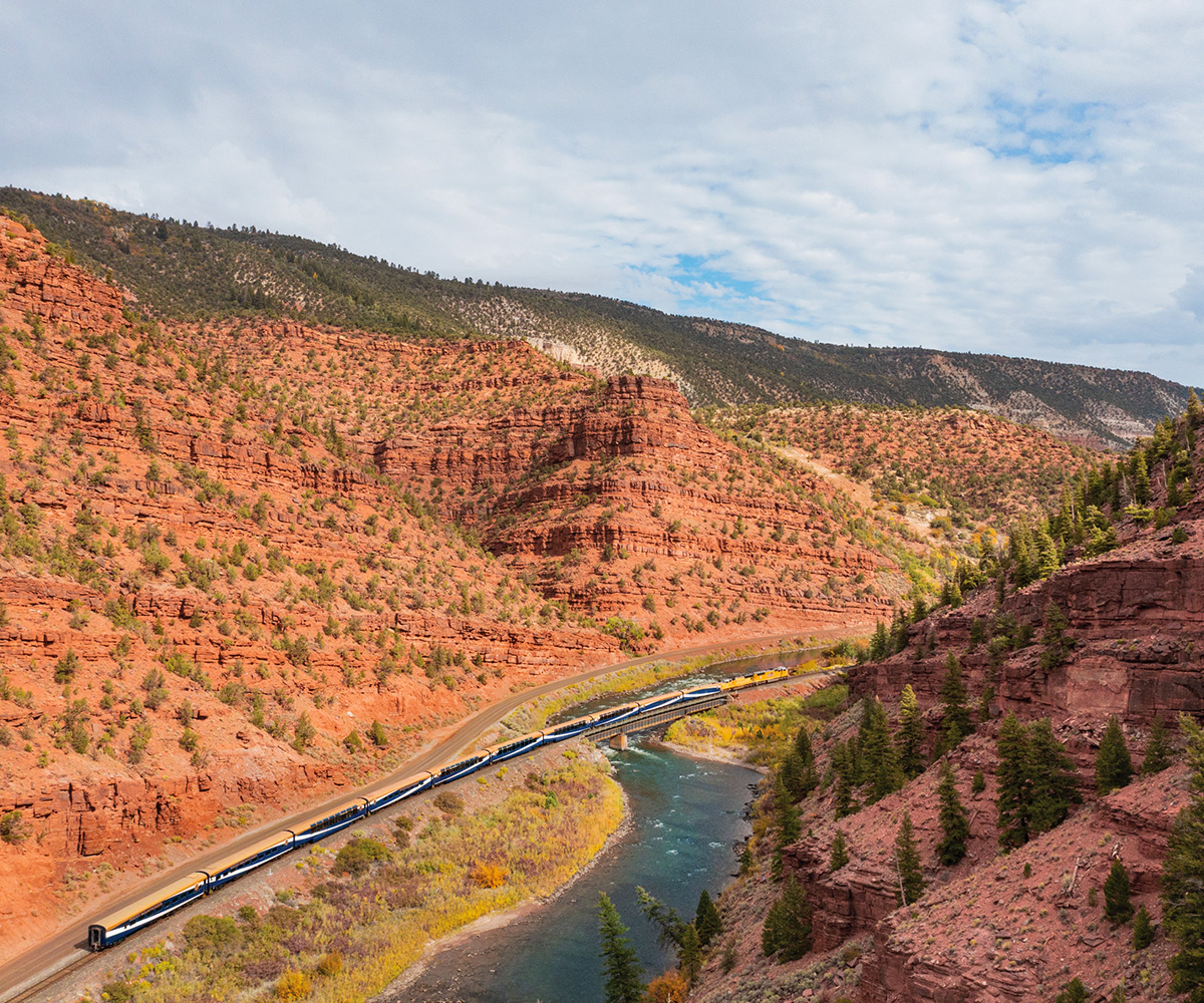 Canyon Spirit train winding through Red Canyon in Wyoming