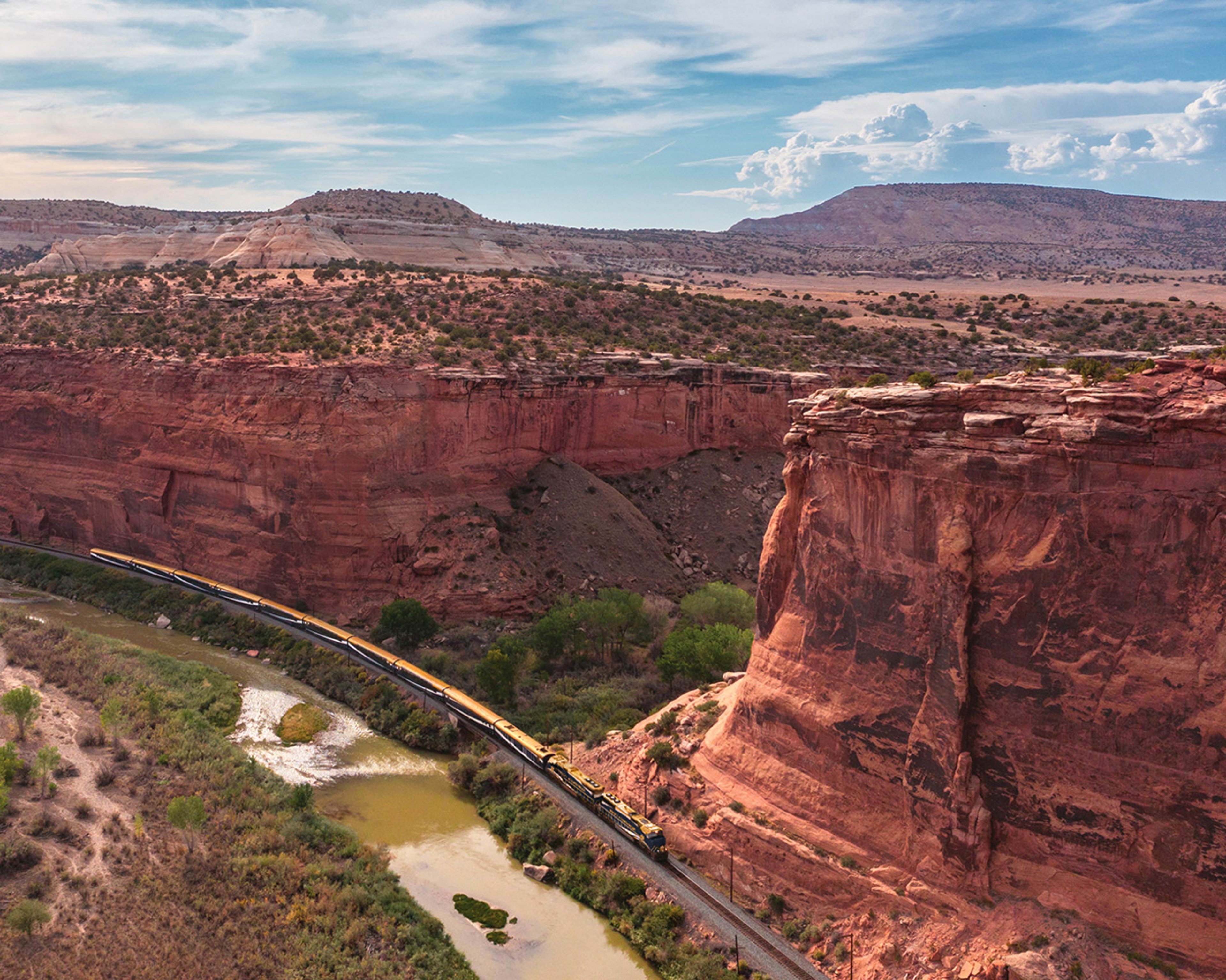 View of Canyon Spirit train running through scenic Ruby Canyon in Utah