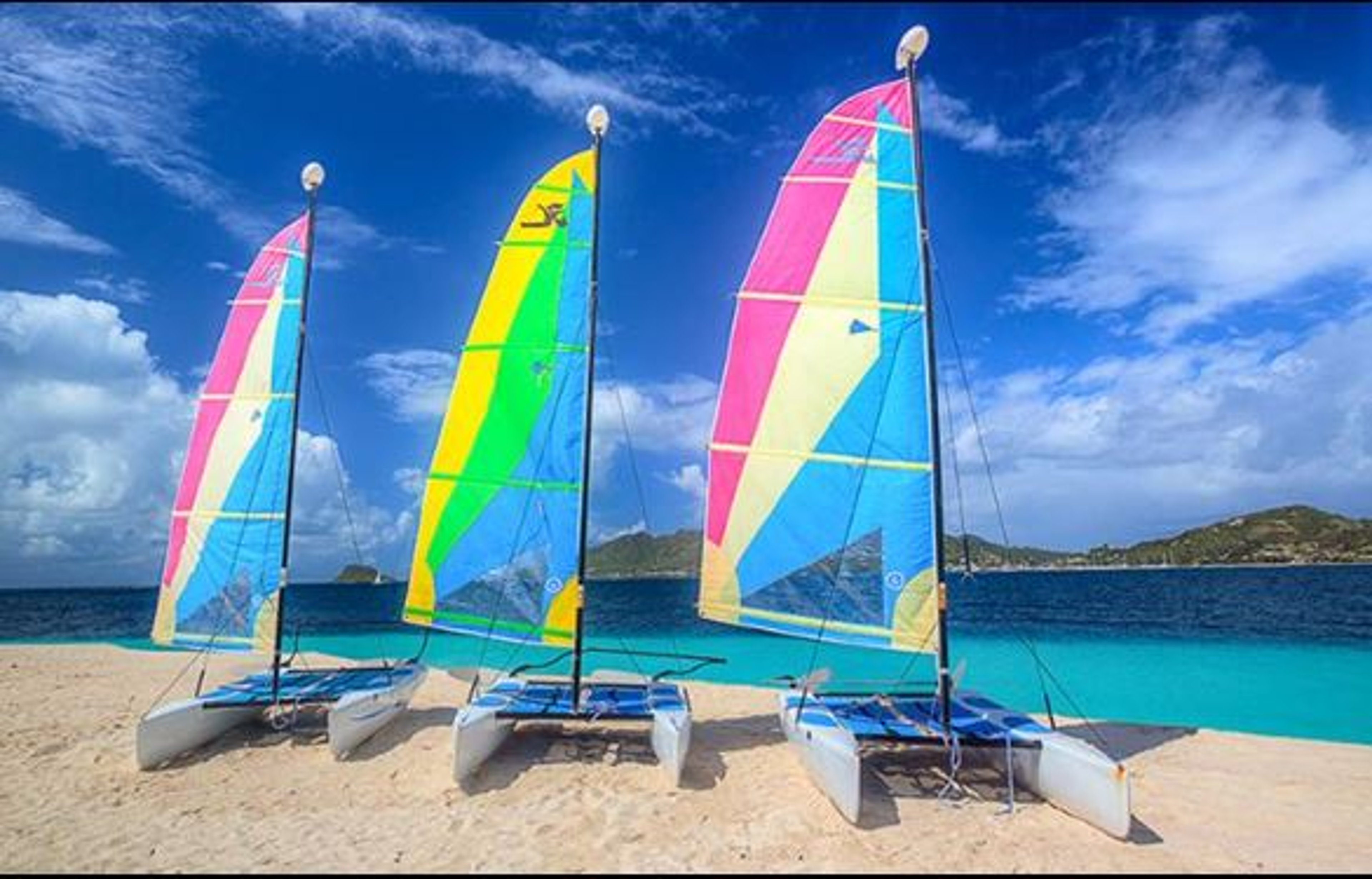 Sail boats waiting on the beach